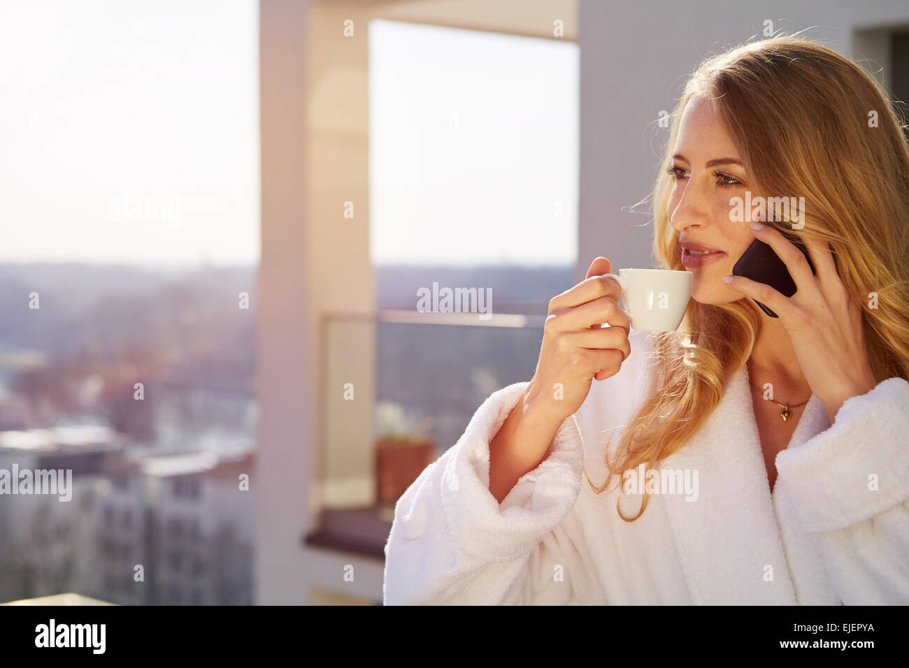 Drinking coffee at home. Stock Photo