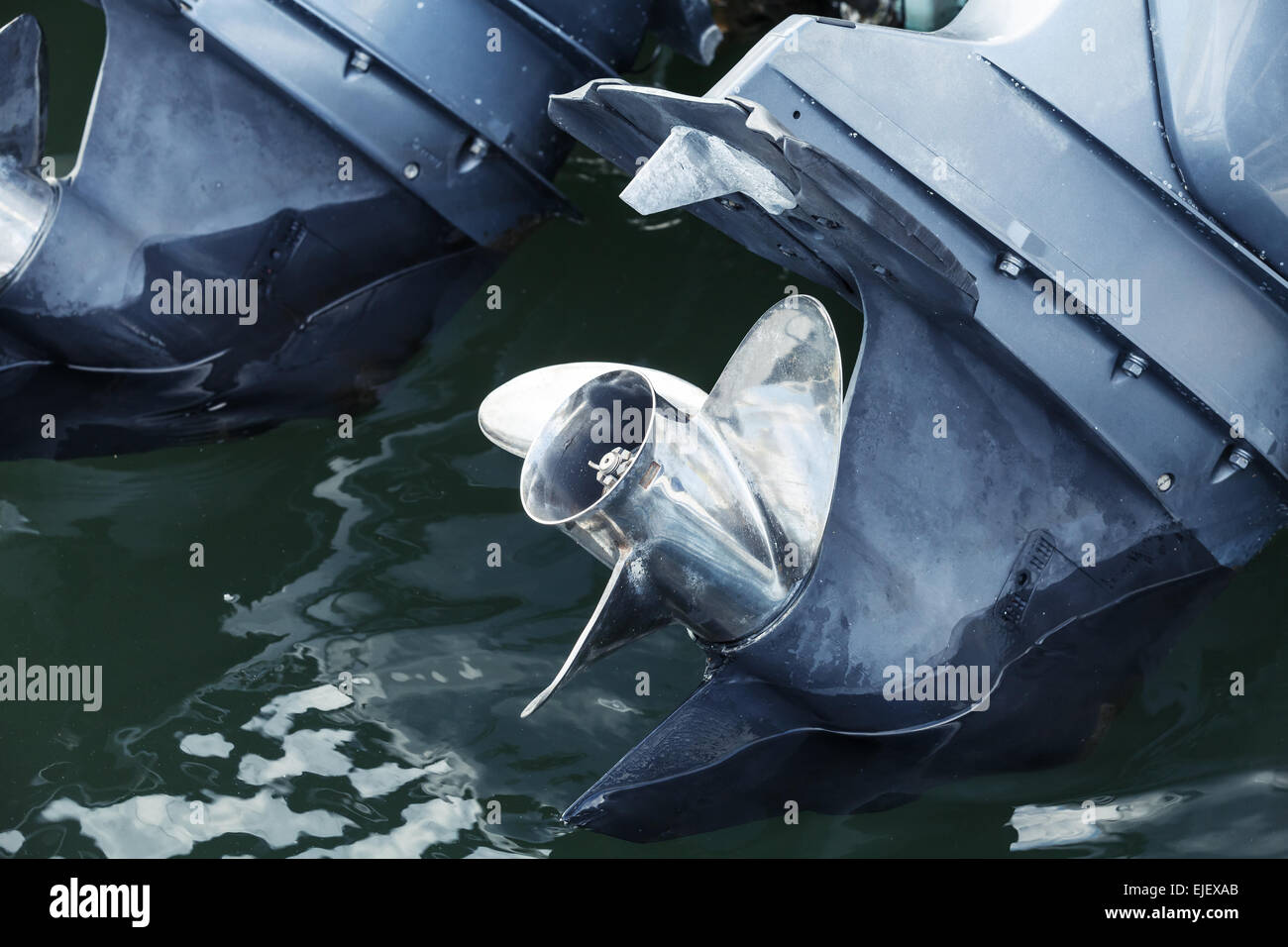 Outboard motor fragment with shining steel propulsion Stock Photo