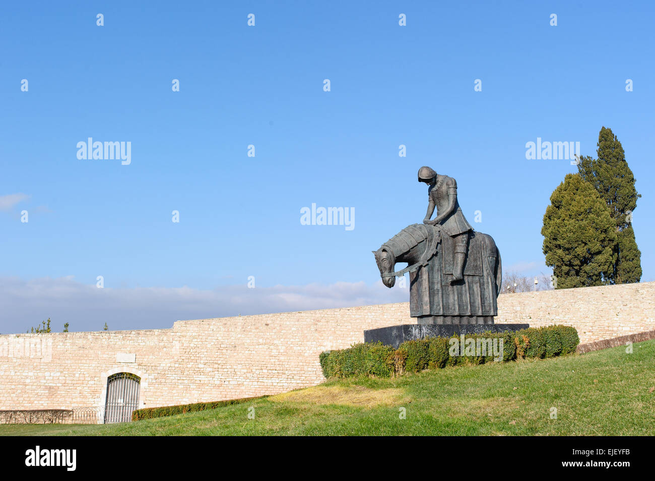 Statue of Saint Francis in bronze in front of the Basilica of San Francesco in Assisi, Umbria, Perugia, Italy. Stock Photo