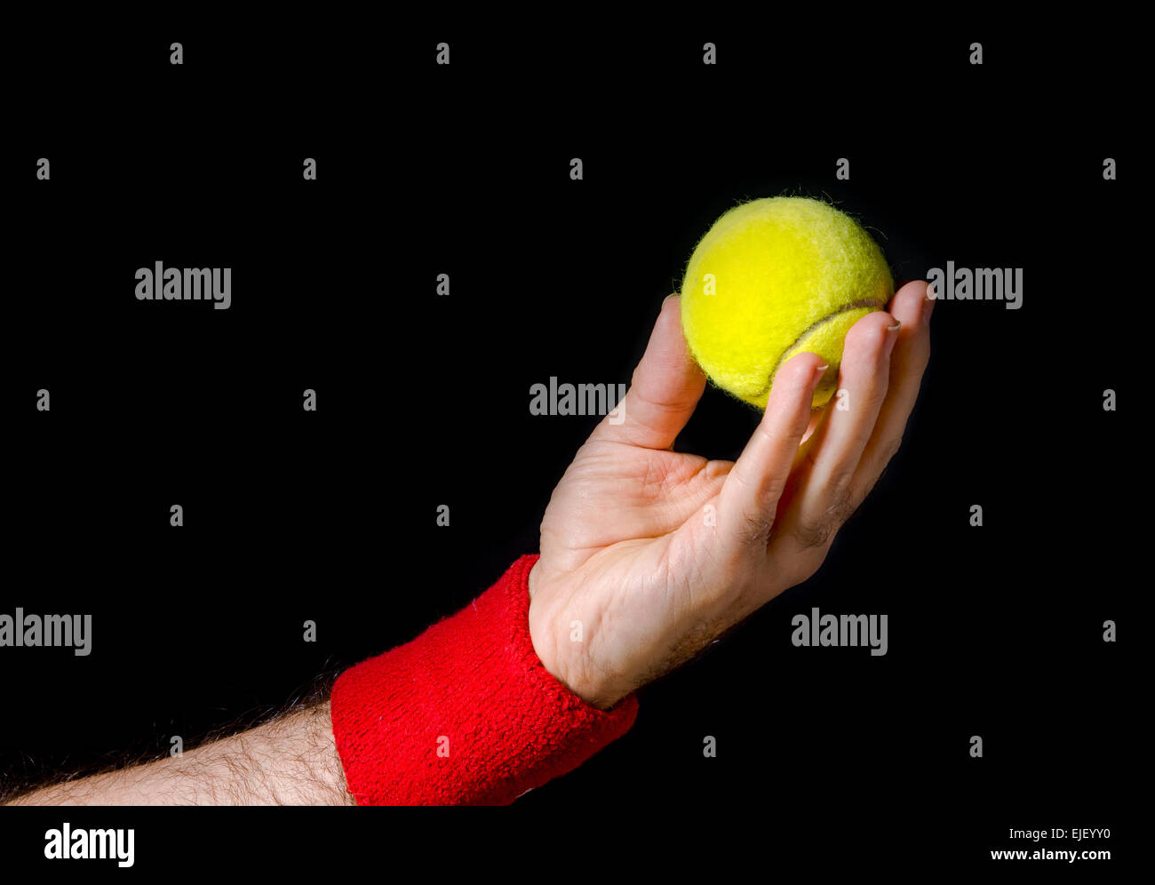 Closeup of man hand, arm, preparing to toss the tennis ball, performing