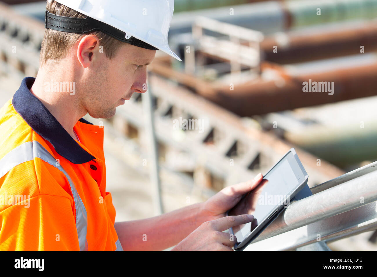 Man working at construction site, helmet Stock Photo