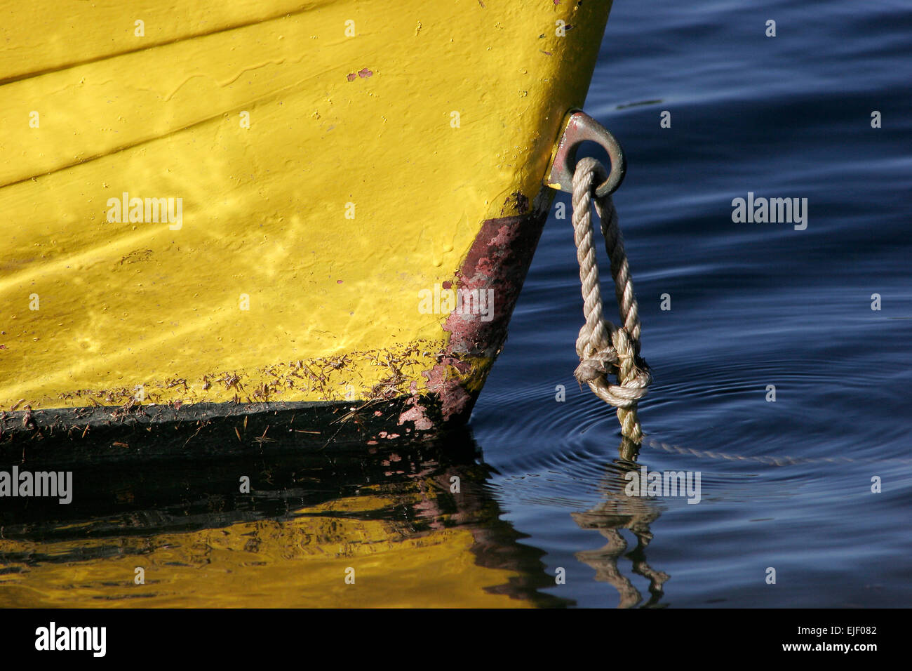 Close-up of yellow boat hull in water Stock Photo