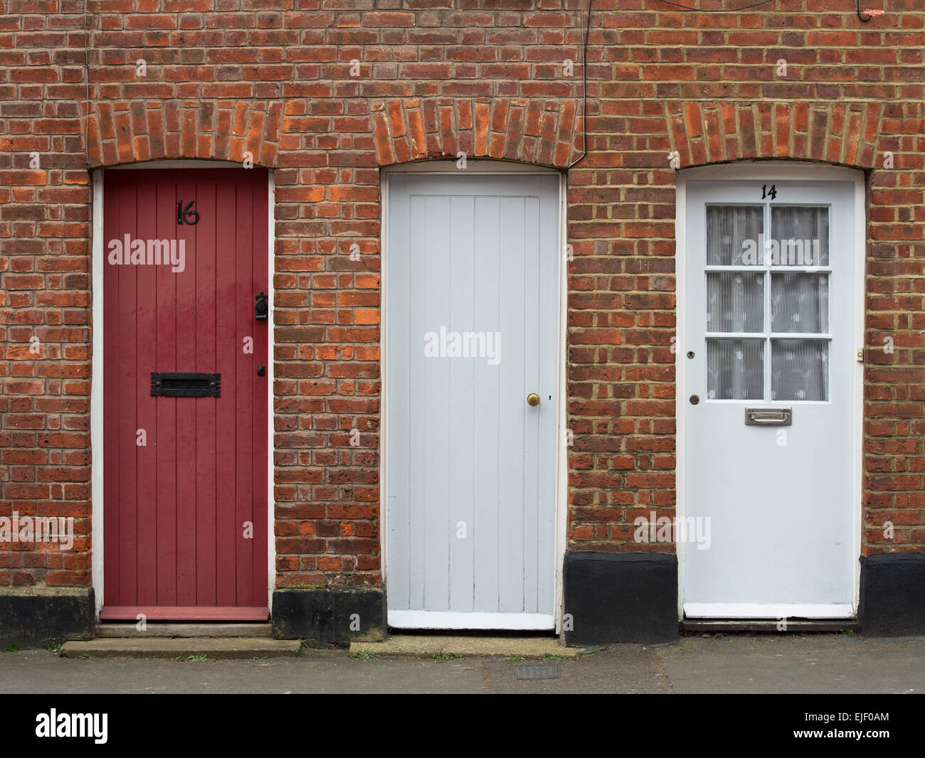 Three wooden front doors. UK Stock Photo