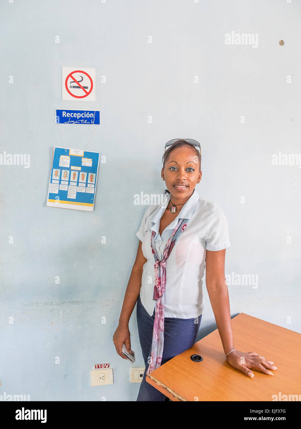 A young female adult computer facility IT director in the small, beachside town of Siboney, Cuba. Stock Photo