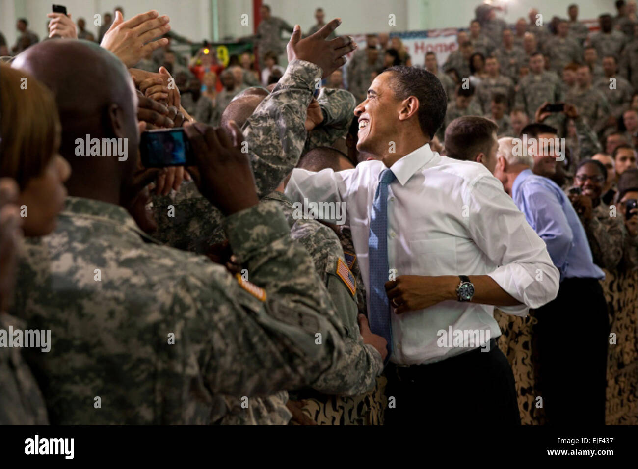 President Barack Obama and Vice President Joe Biden shake hands with the troops following the president's remarks at Fort Campbell, Ky., May 6, 2011. The skill and courage of countless American military and intelligence professionals is why Osama bin Laden can never threaten America again, Obama told the cheering group of 101st Airborne Division soldiers. Stock Photo