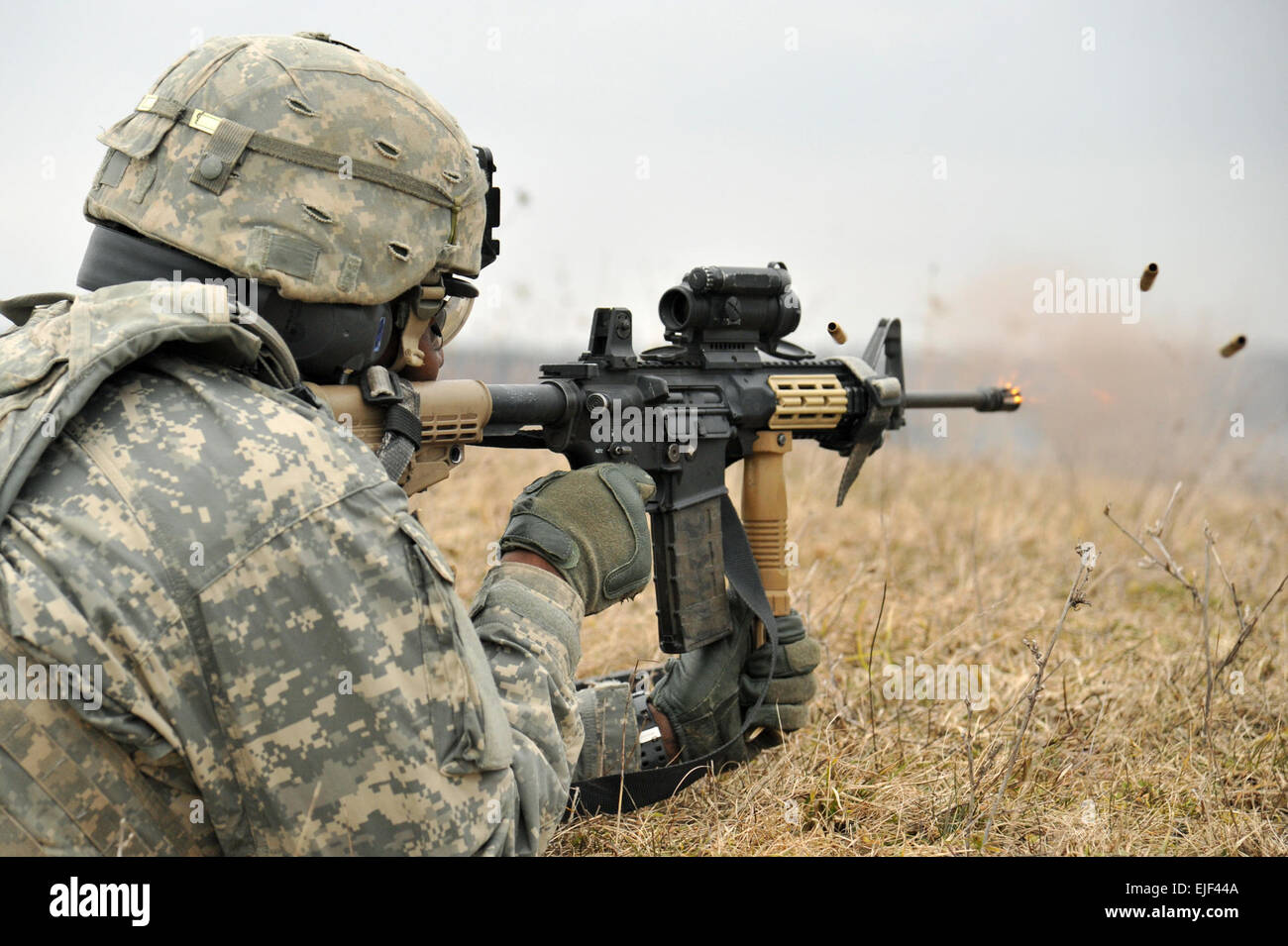 A U.S. Army paratrooper assigned to Company A, 173rd Airborne Brigade Special Troops Battalion engages a target during a combined defensive live-fire exercise March 6, 2015, at the 7th Army Joint Multinational Training Command in Grafenwoehr, Germany. Paratroopers from the 173rd Airborne Brigade and Dutch sappers from the 411th Armored Engineers of the Royal Dutch Army participated in the combined defensive exercise to promote interoperability and strengthen the NATO alliance.  Visual Information Specialist Markus Rauchenberger/released Stock Photo