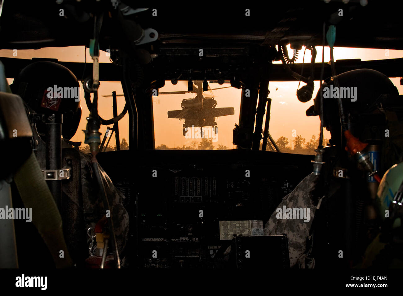 During an early morning start, an orange glow from the sun fills the sky as a team of UH-60 Black Hawk helicopters from Company B, 3rd Battalion, 227th Aviation Regiment, 1st Air Cavalry Brigade, 1st Cavalry Division, Multi-National Division-Baghdad, depart Camp Taji Airfield, Iraq, Aug. 18, 2009. The aircrews are flying to a training area where they will be conducting training with Iraqi army soldiers. Sgt. Travis Zielinski Stock Photo