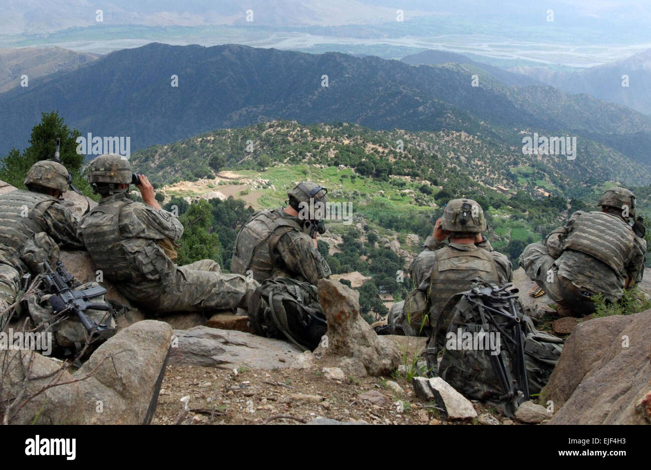 070822-A-6849A-667 -- Scouts from 2nd Battalion, 503rd Infantry Regiment Airborne, pull overwatch during Operation Destined Strike while 2nd Platoon, Able Company searches a village below the Chowkay Valley in Kunar Province, Afghanistan Aug. 22. Stock Photo