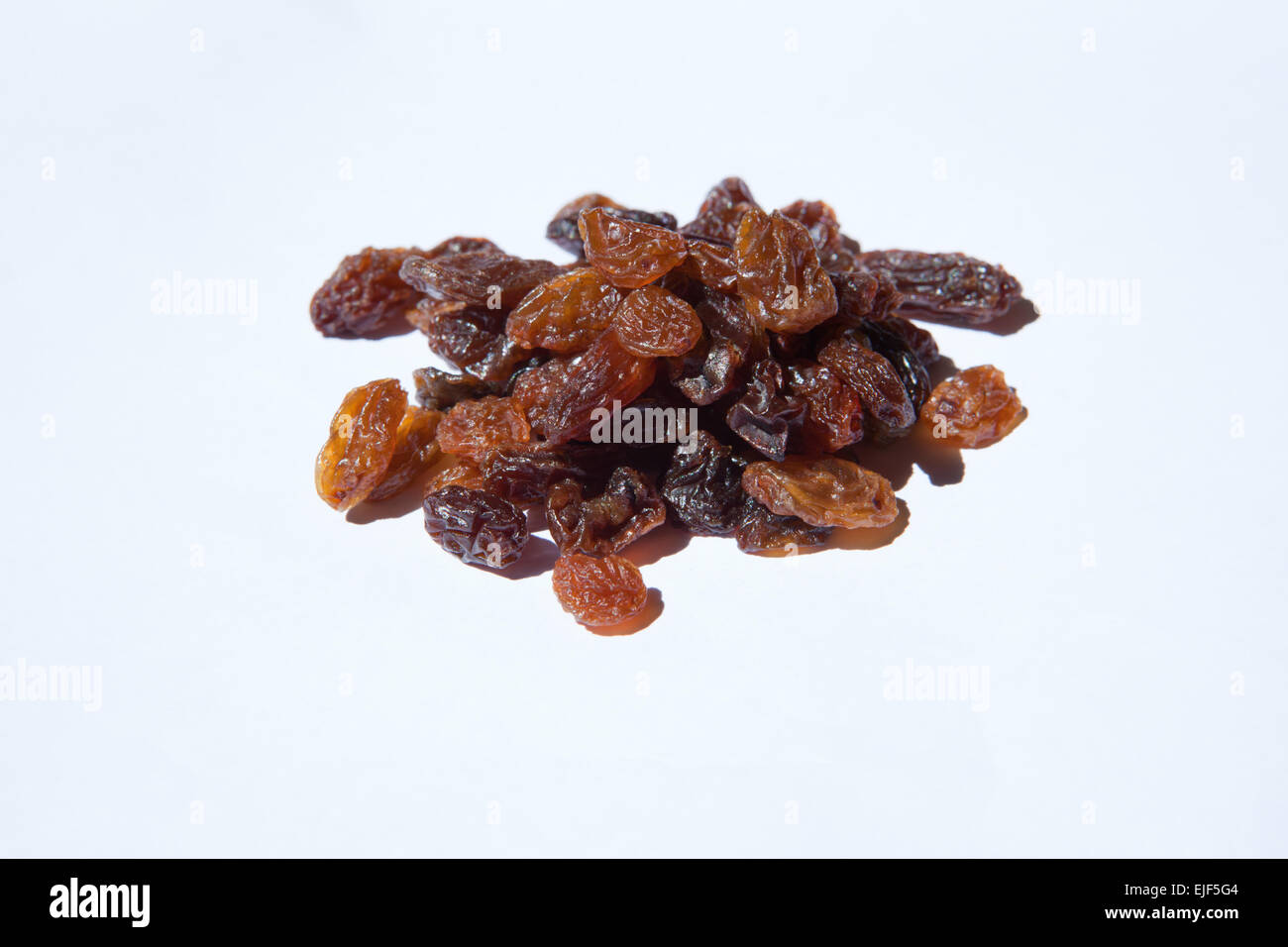 Bunch of dried grapes isolated on white Stock Photo - Alamy