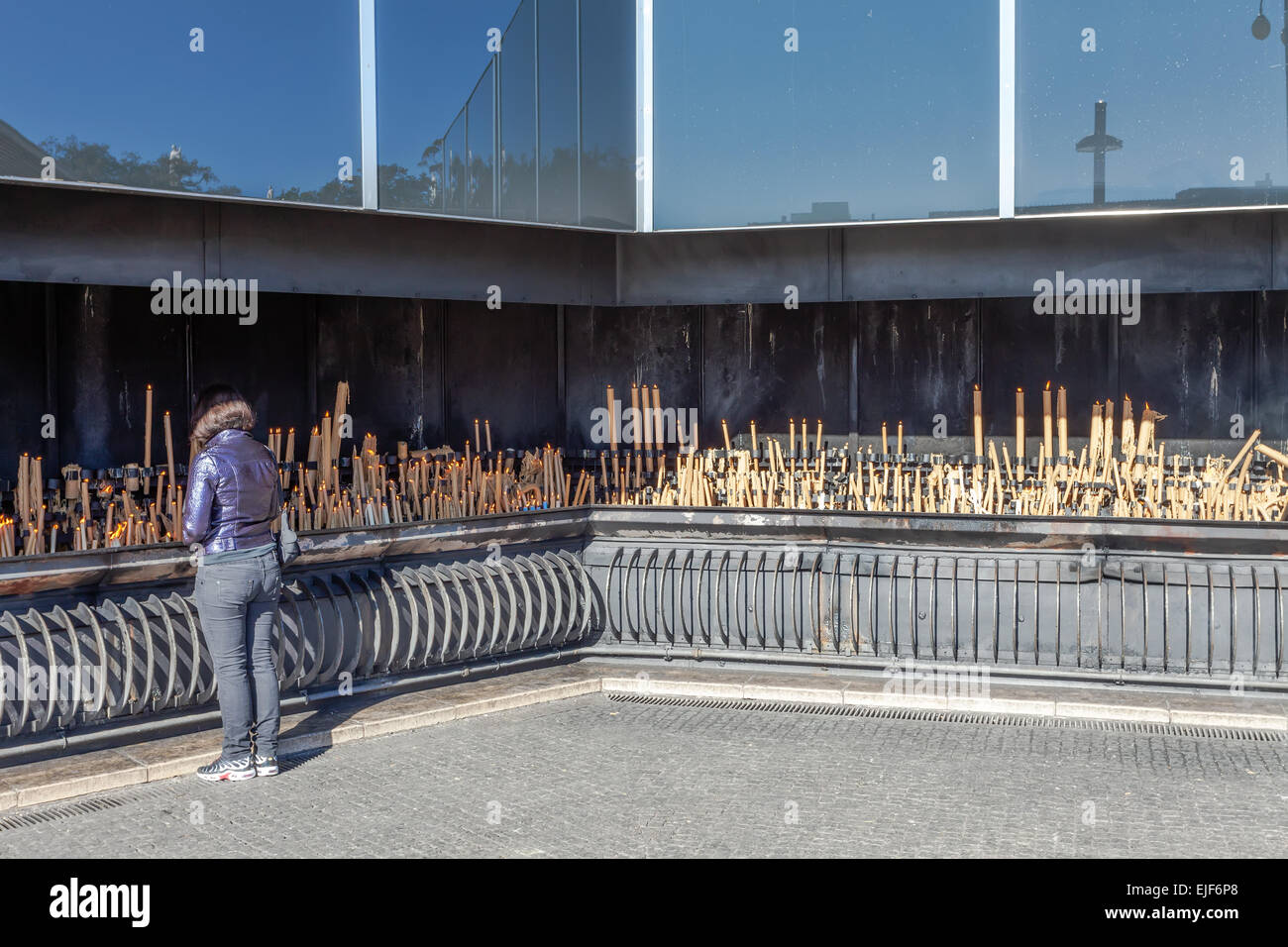 Sanctuary of Fatima, Portugal. Pilgrims burning votive candles as fulfillment of vows made to Our Lady. Stock Photo