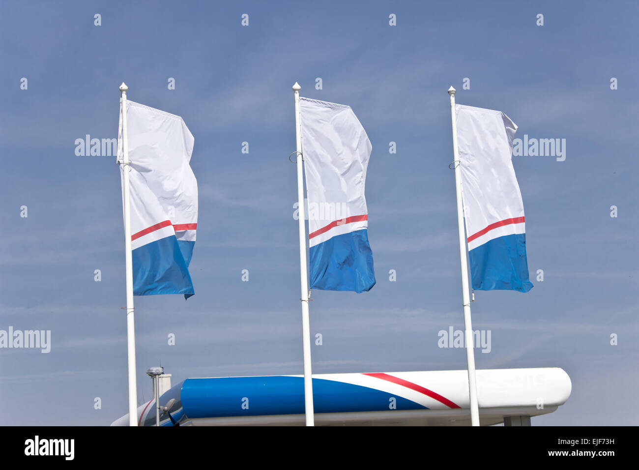 Three empty  banner flags over blue sky Stock Photo