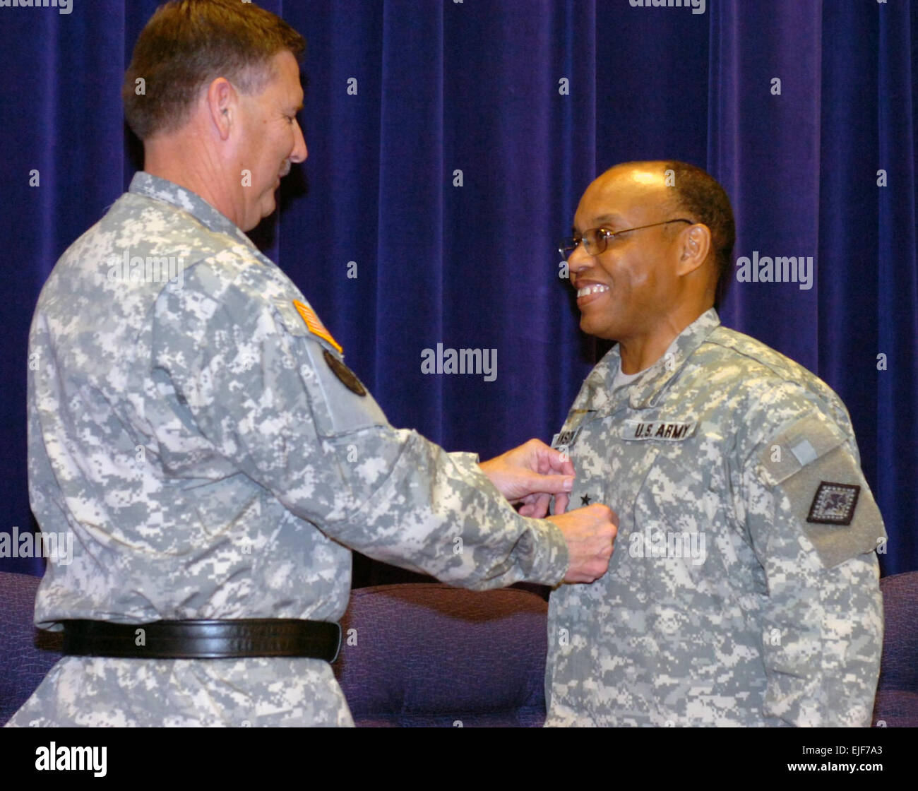 Brig. Gen. William J. Johnson, is pinned by Maj. Gen. William D. Wofford, the adjutant general of Arkansas, becoming the first African American general in the 203 year history of the Arkansas National Guard. Stock Photo