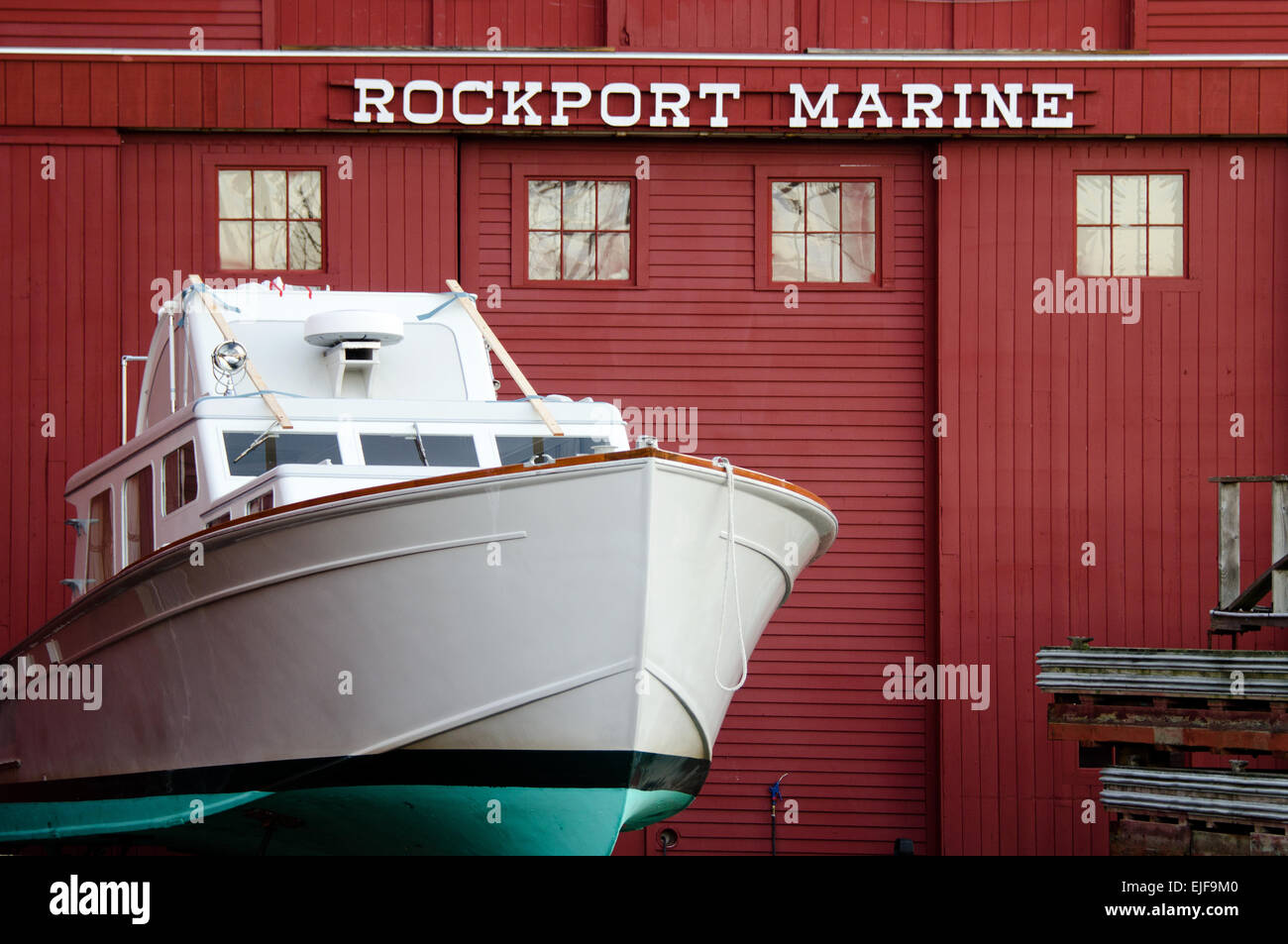 A boat is readied for winter at the Rockport Marine boatyard in