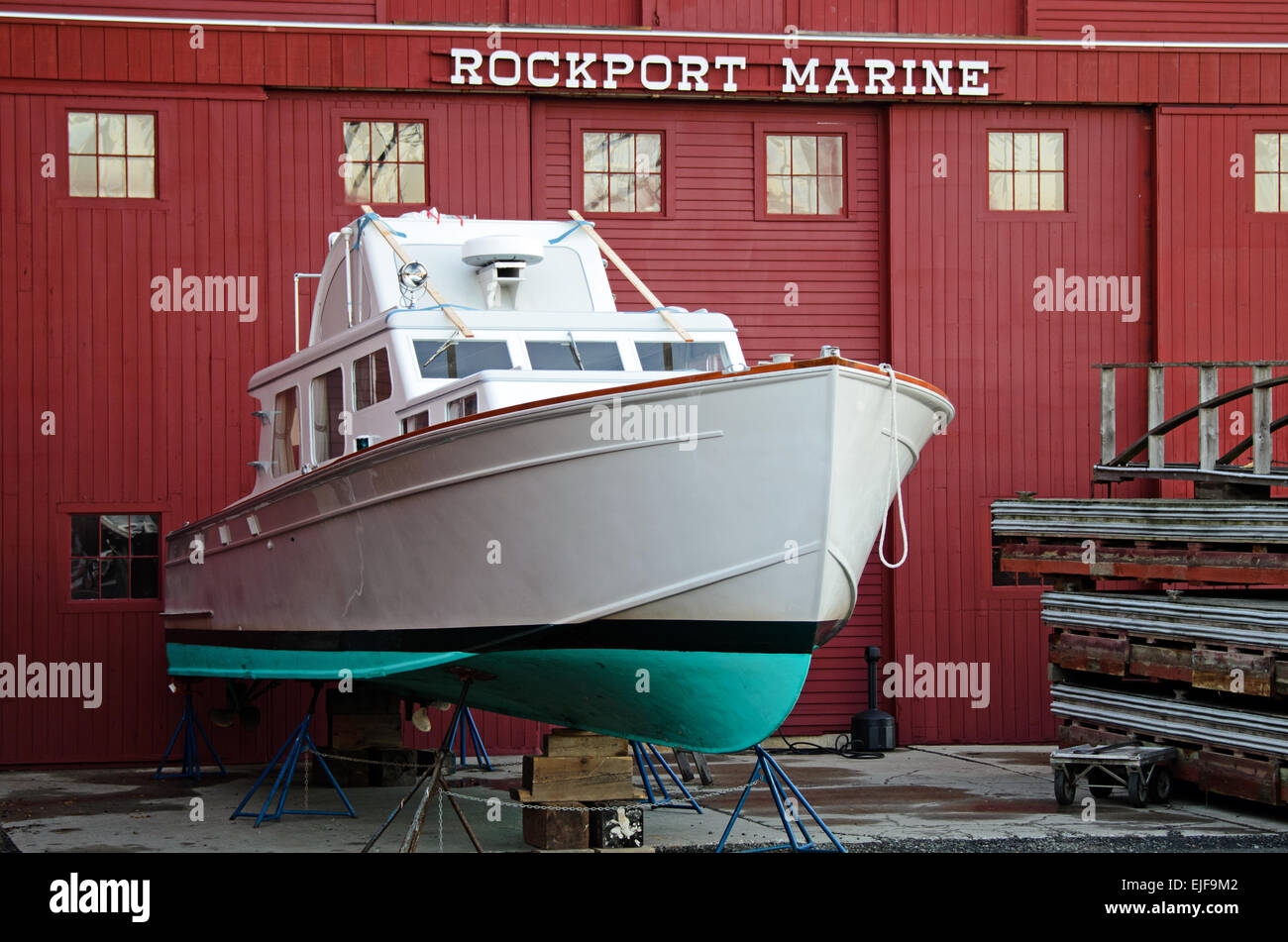 A boat is readied for winter at the Rockport Marine boatyard in