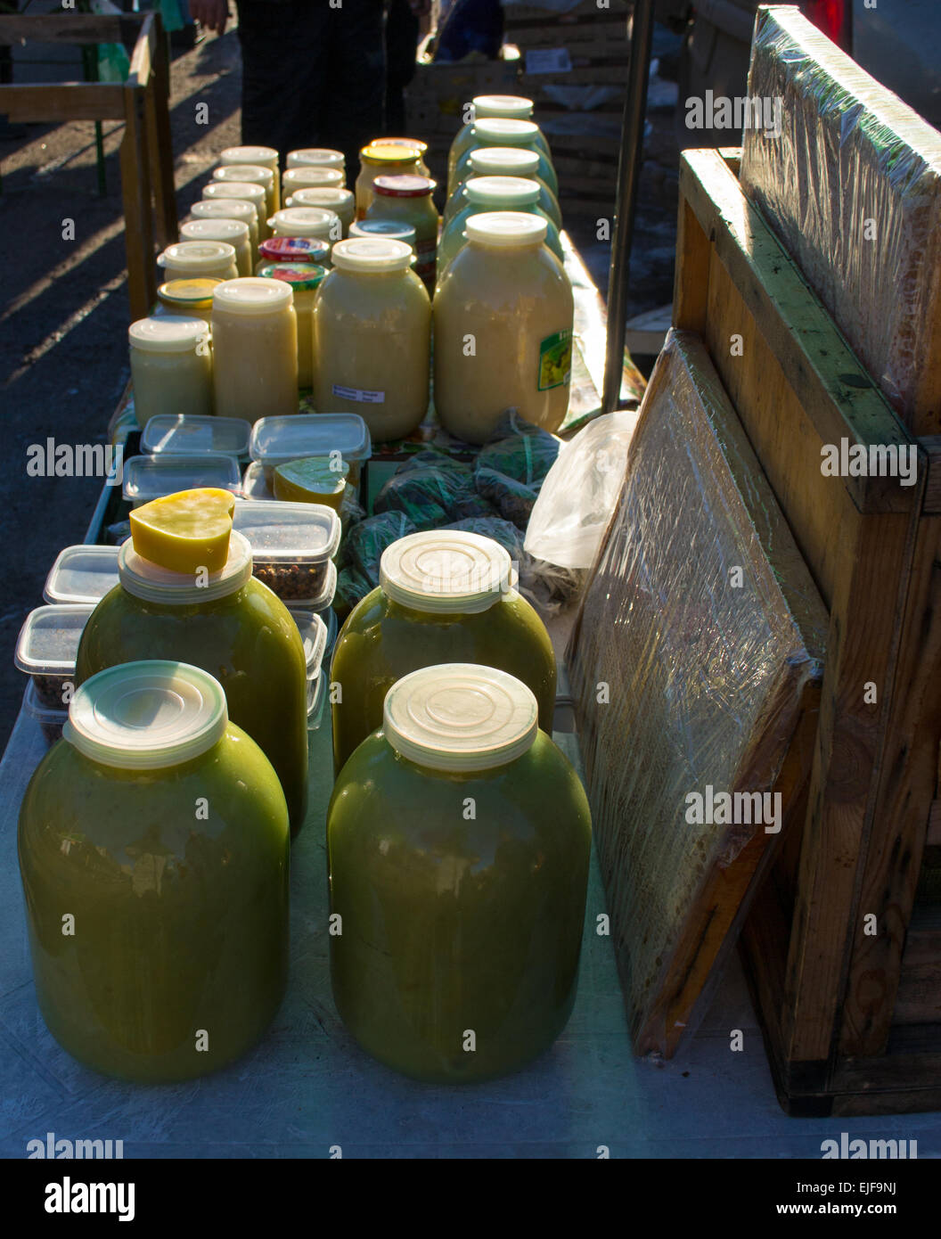 Glass jars full of raw organic honey and fresh Stock Photo