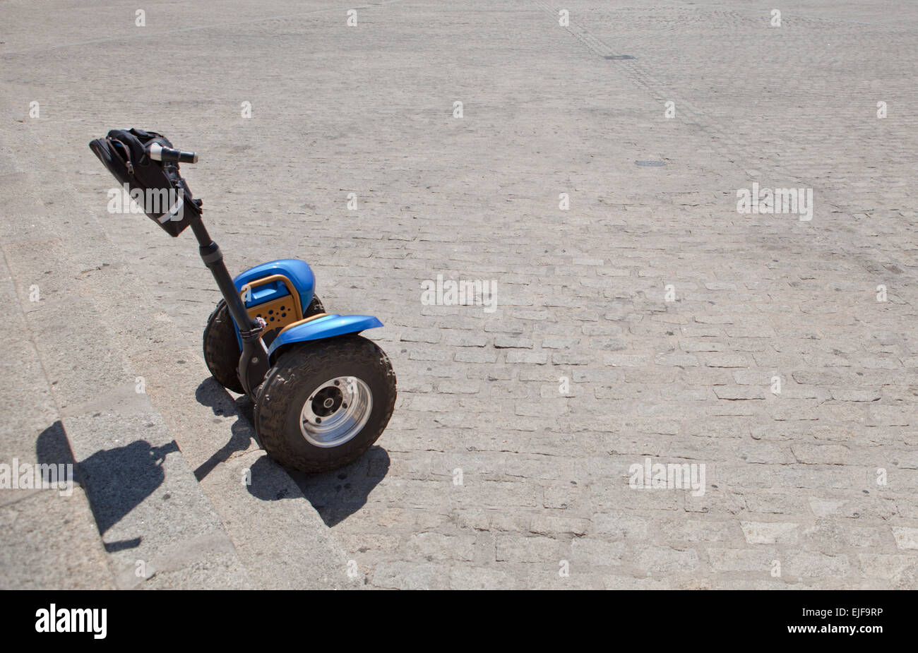 Segways vehicles for rent to tourists at historical square, Spain Stock Photo