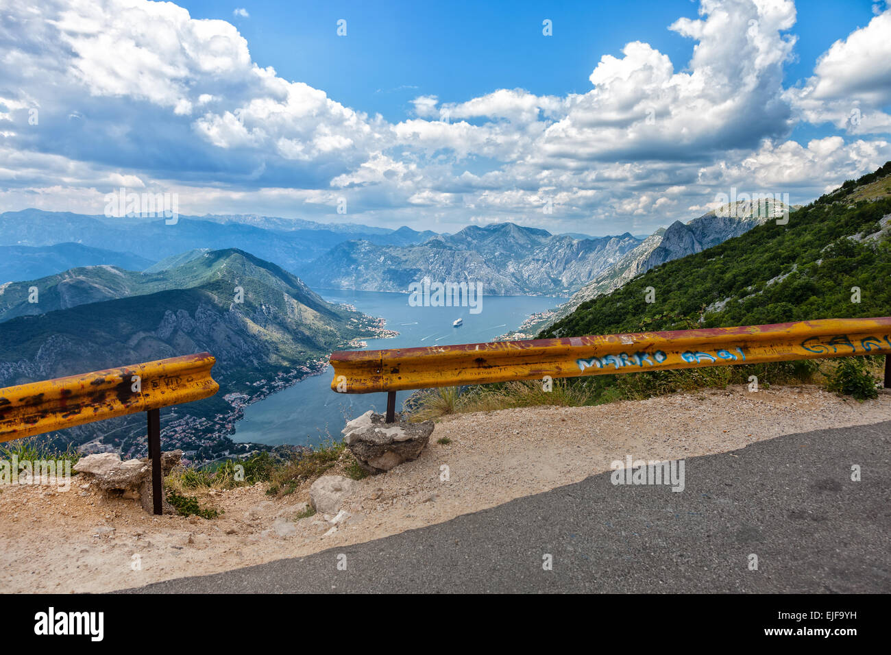 Dangerous mountain road over a precipice in the background Bay of Kotor, Montenegro. Stock Photo
