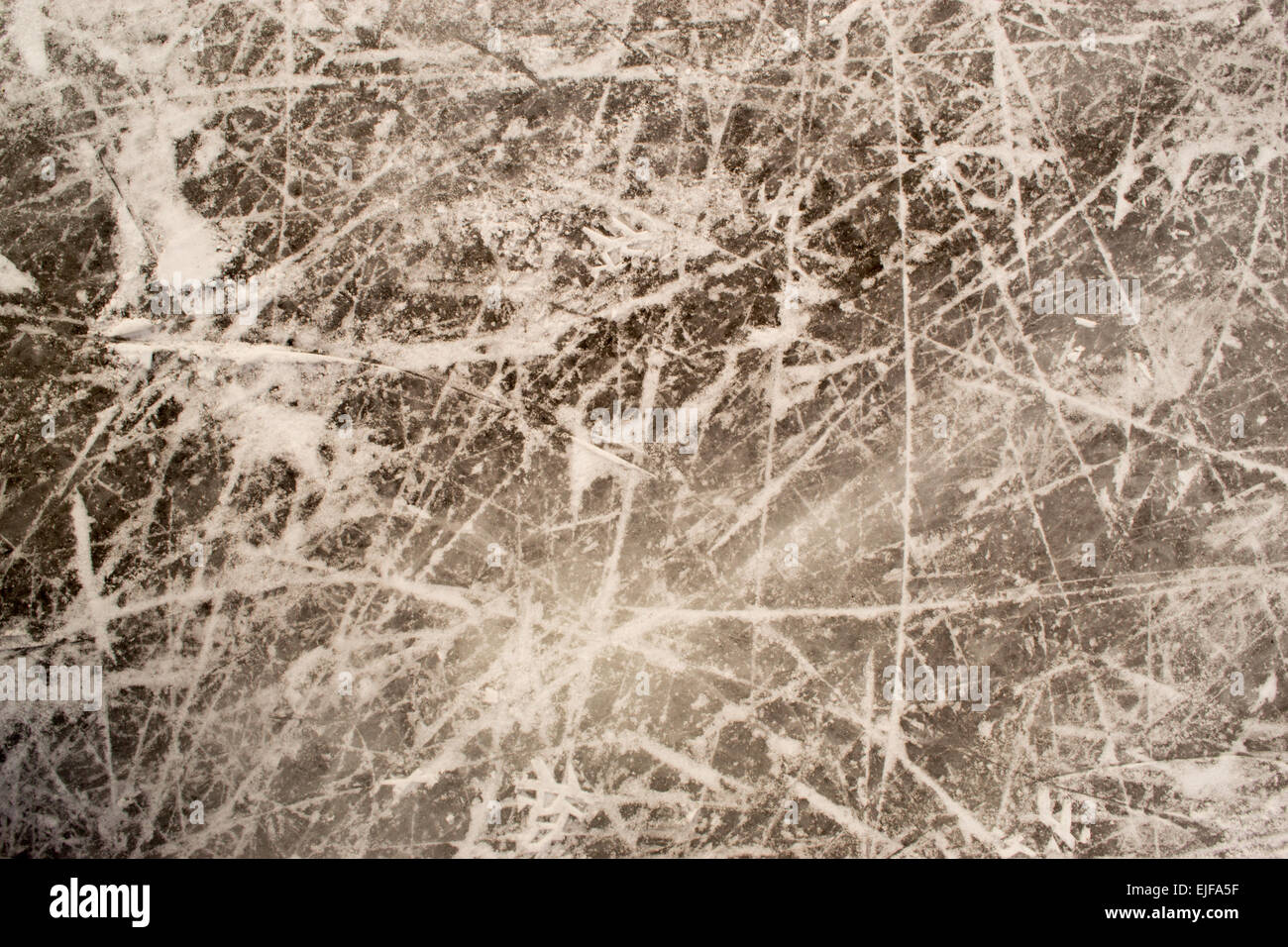 Scratches and marks on ice from ice skates, hockey, and skating Stock