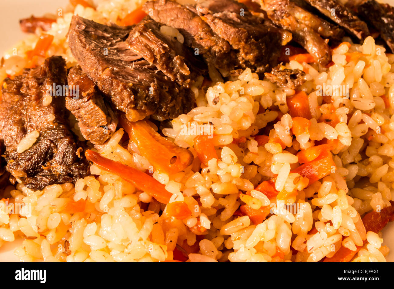 A traditional Russian dish Pilaf consisting of rice, beef, carrots