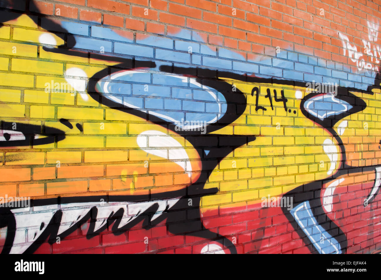 Urban street art on an urban brick wall in a city Stock Photo - Alamy