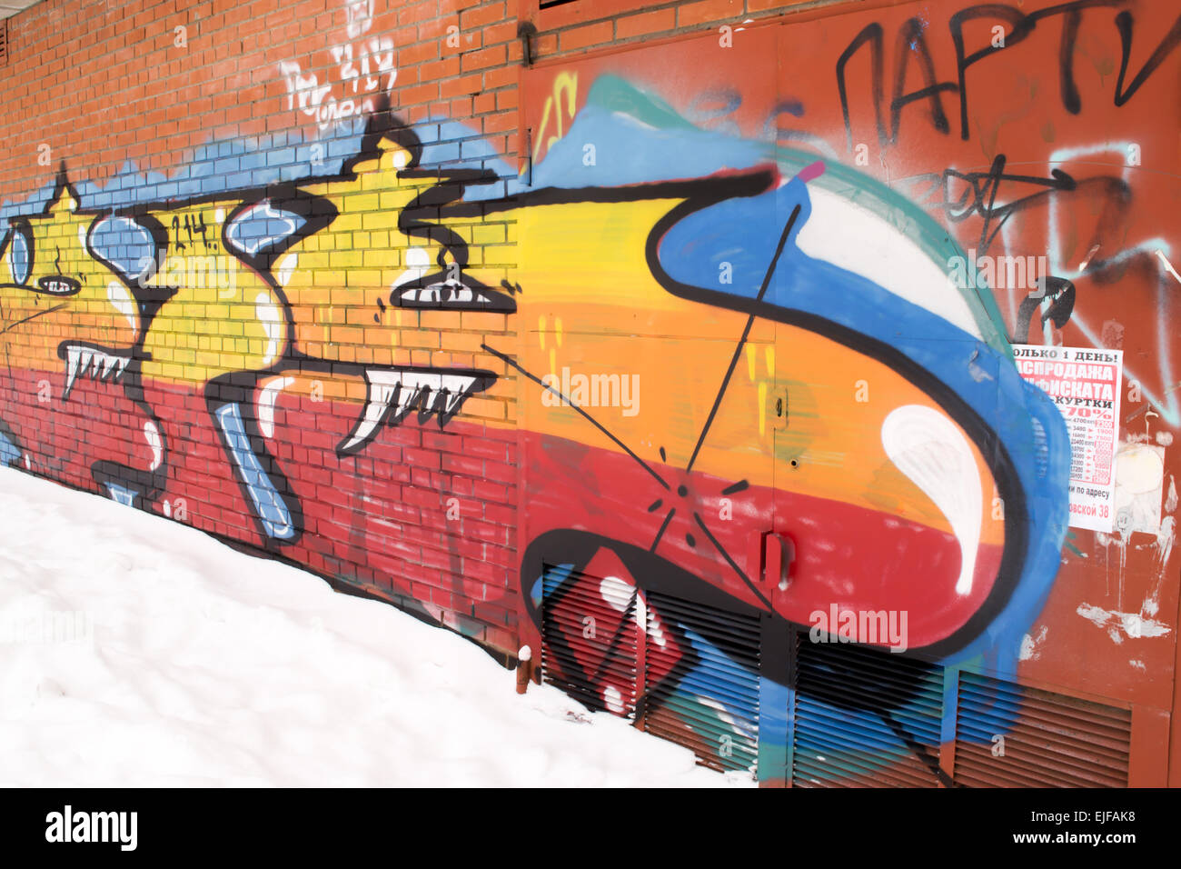 Urban street art on a brick wall in a city Stock Photo - Alamy