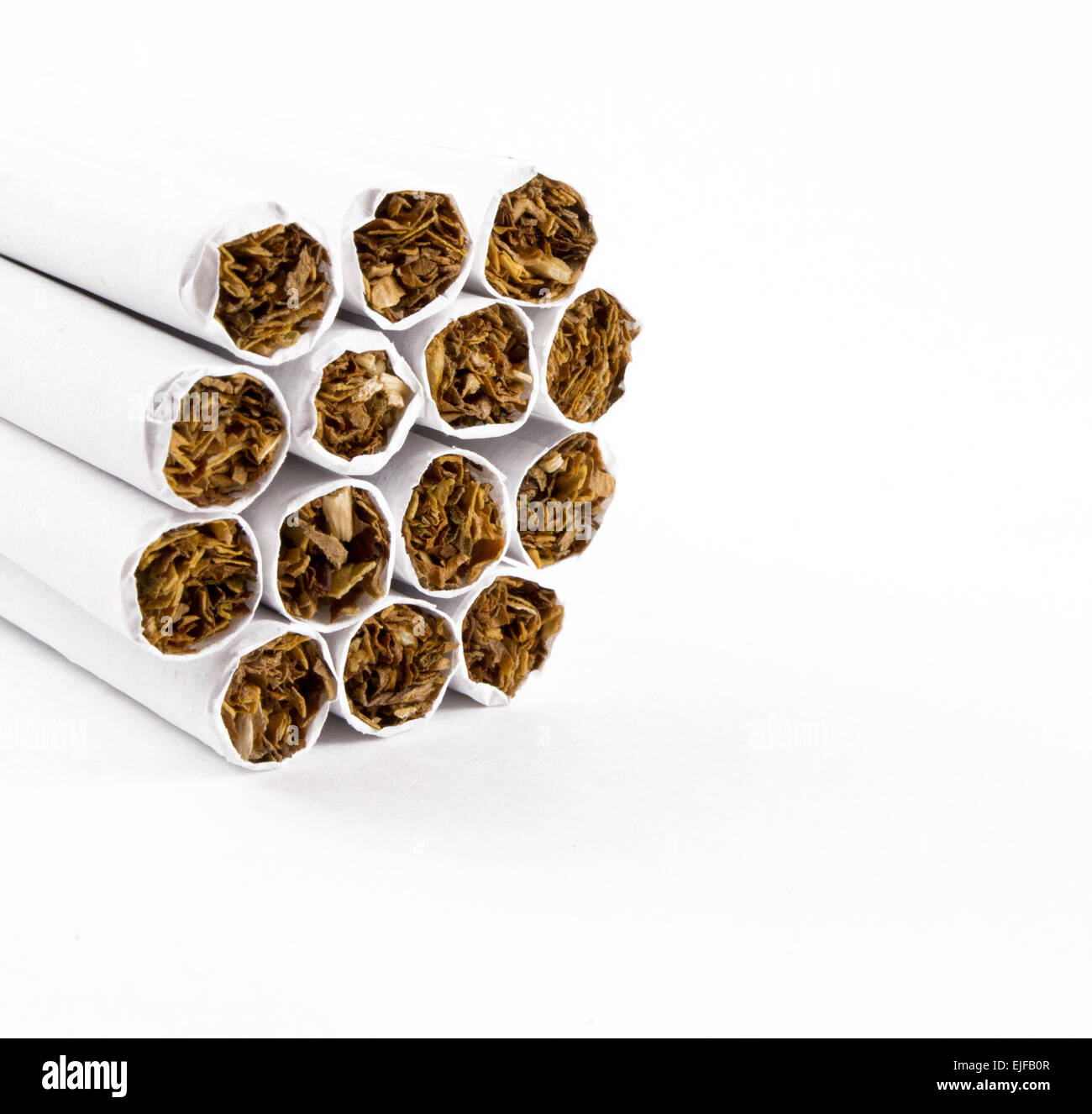 Unlit cigarette ends bunched together ready for igniting Stock Photo