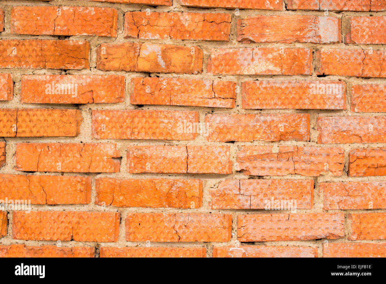 Industrial red brick wall with bricks and mortar cement Stock Photo