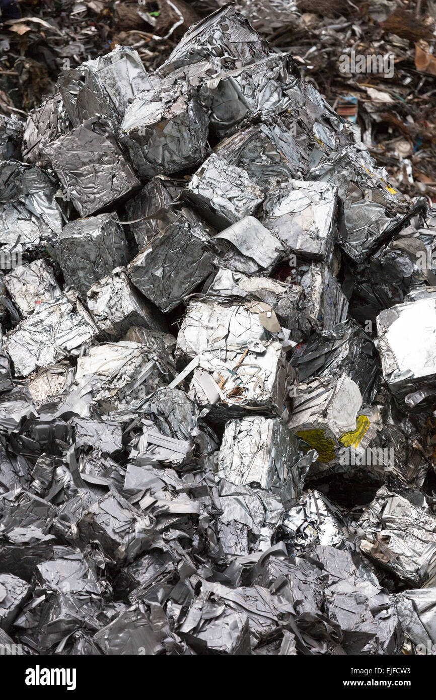 Recycling scrap metal dealer, dealing in ferrous and non-ferrous metals,  compacted into cubes to stop environmental pollution Stock Photo - Alamy