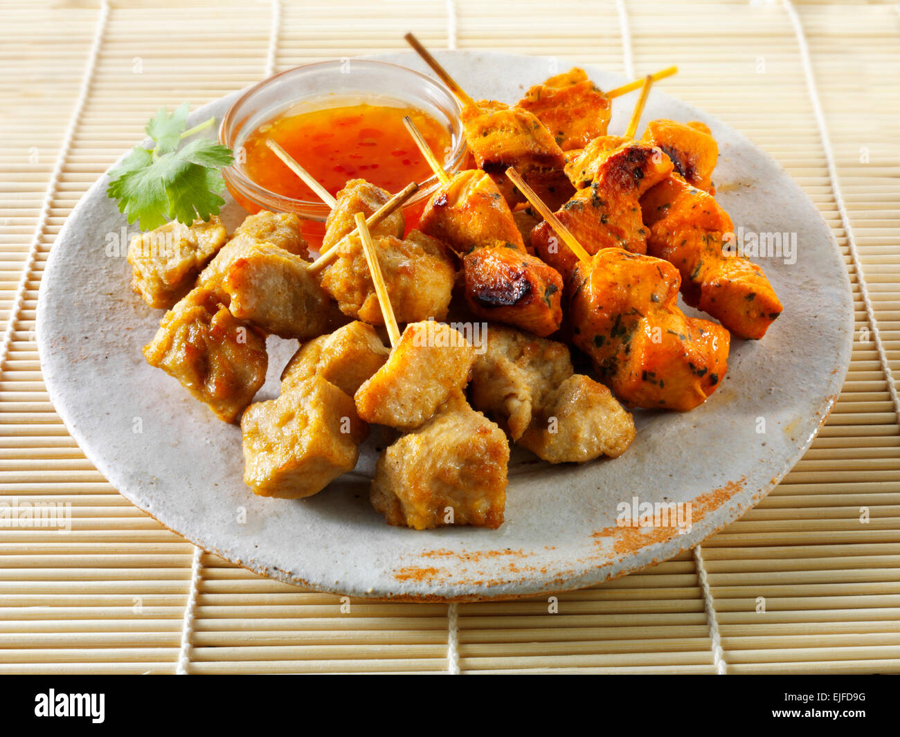 Oriental satay with chilli dipping sauce Stock Photo