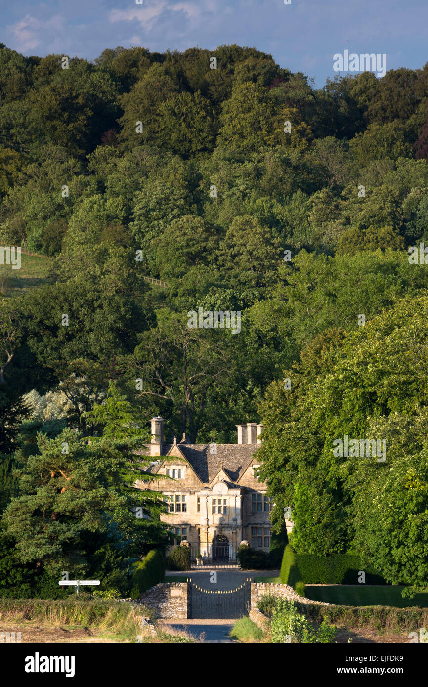 Upper Slaughter Manor House, grand country mansion and signpost in Upper Slaughter in The Cotswolds, Gloucestershire, UK Stock Photo