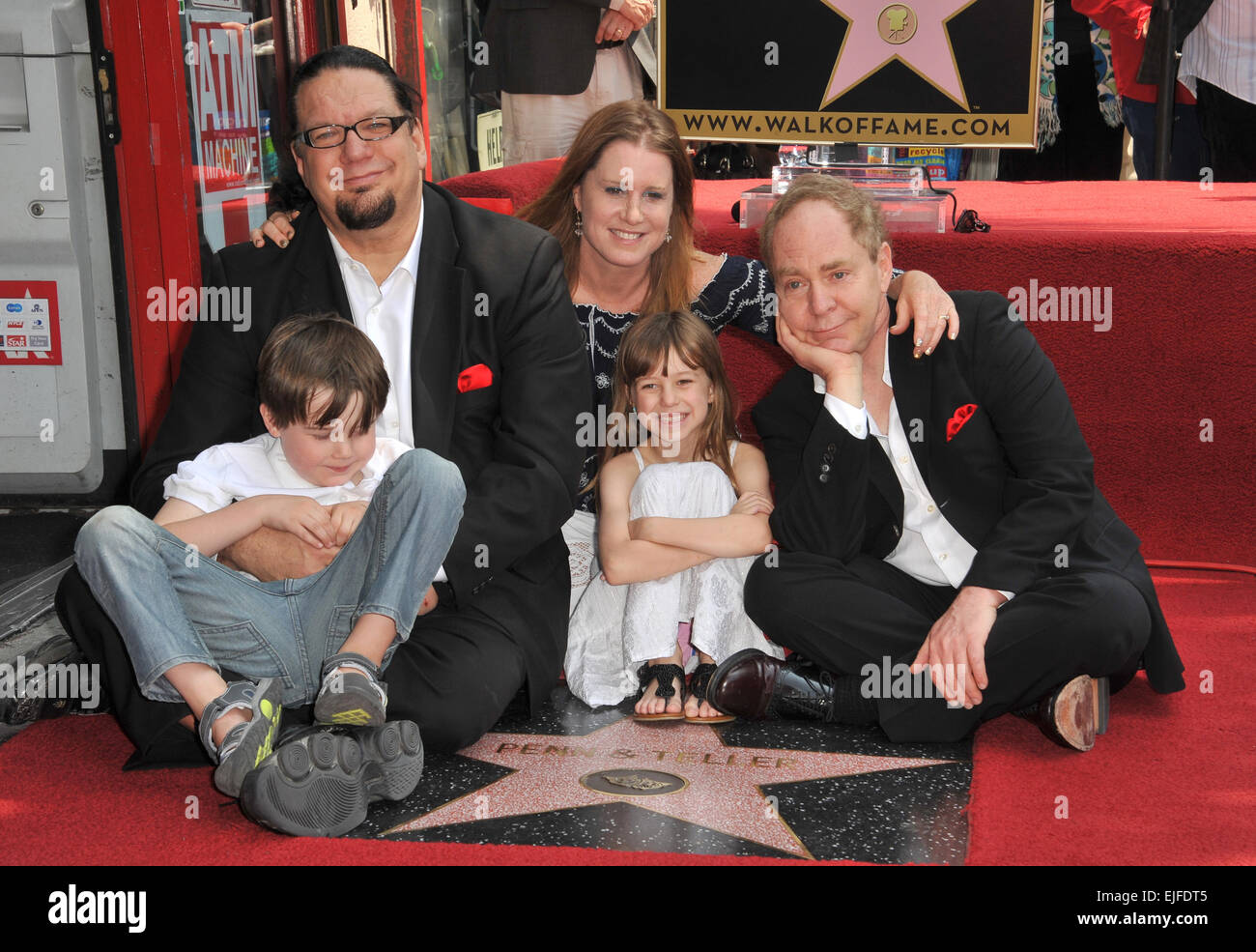 LOS ANGELES, CA - APRIL 5, 2013: Magicians Penn Jillette (left) & Raymond  Teller with Penn's children Zolten & Moxie Crimefighter & wife Emily Zolten  on Hollywood Boulevard where they were honored