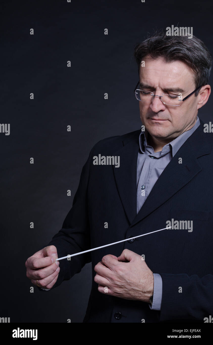 Portrait of a conductor using his baton Stock Photo Alamy
