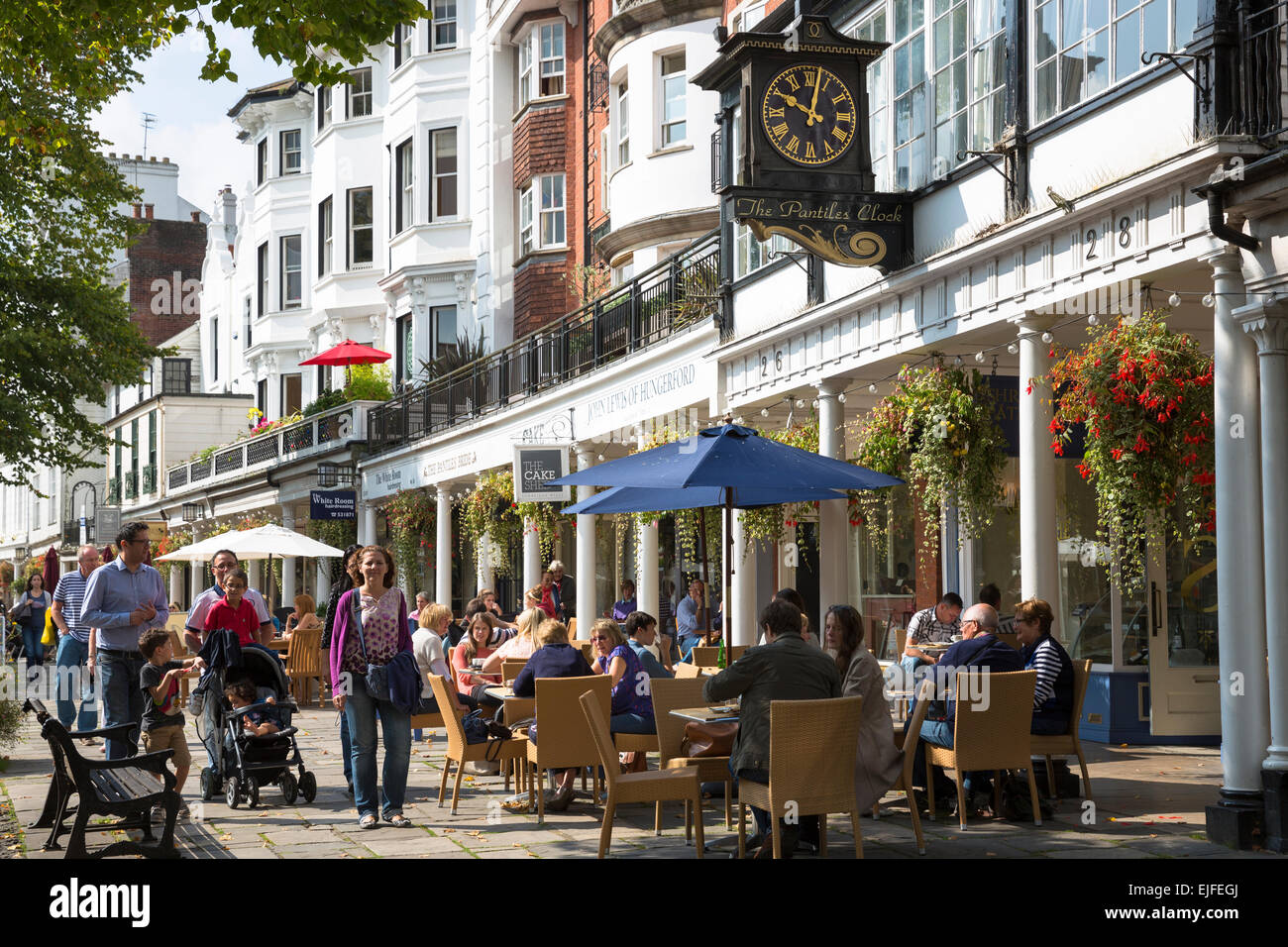 Street scene at The Pantiles crowded pedestrian area of Tunbridge Wells, shops and people eating at pavement cafes in Kent, England, UK Stock Photo