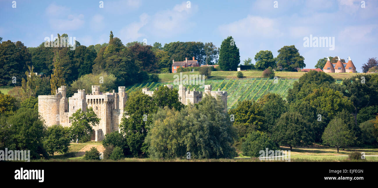 Spectacular 14th Century Bodiam Castle, National Trust, vineyard and oast houses on East Sussex and Kent border, England, UK Stock Photo