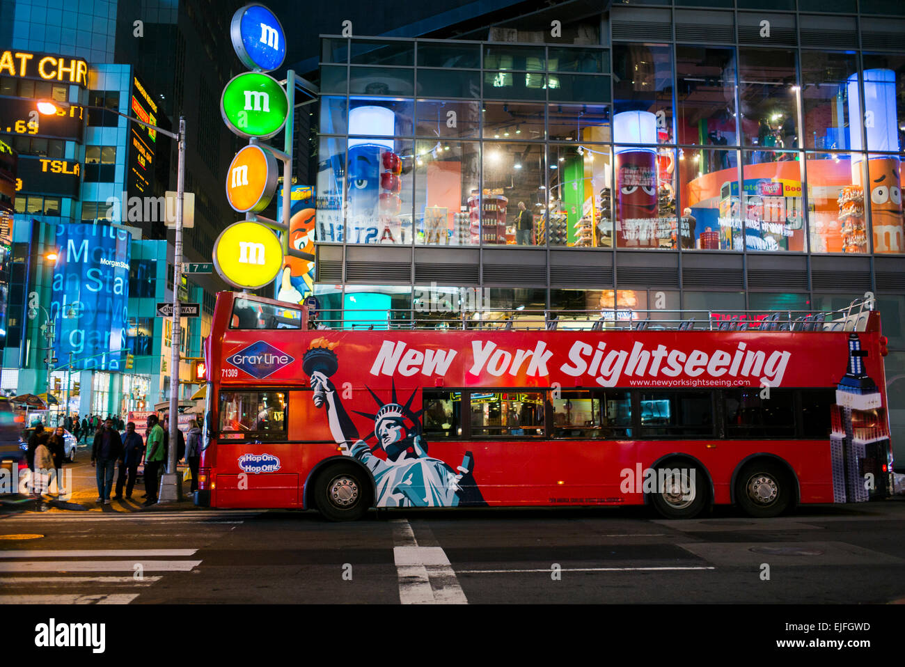 Tour bus on the road at night, Times Square, Manhattan, New York City ...
