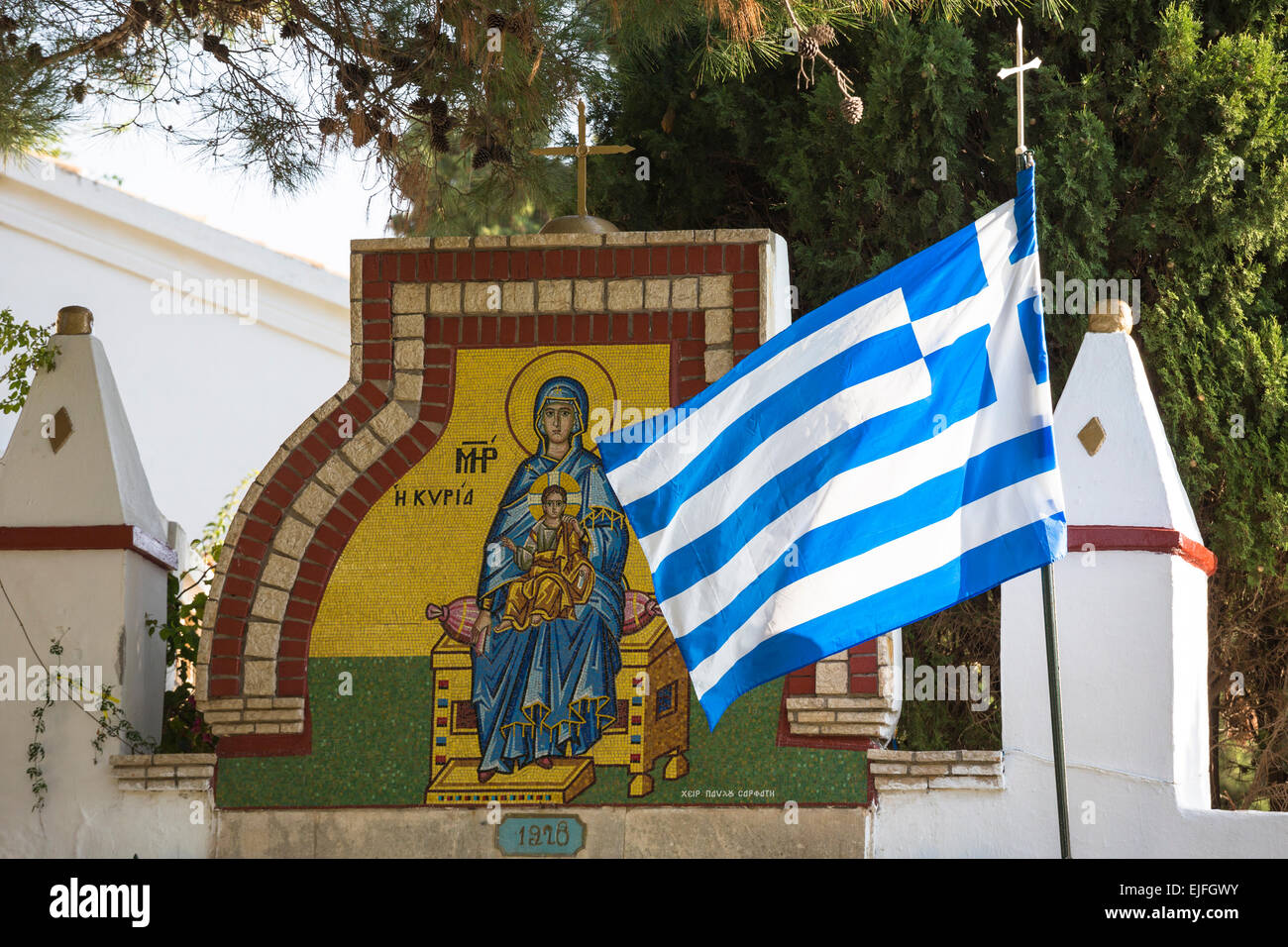 Corfu flag and Greek Orthodox religious iconic painting madonna Mary and Jesus Christ, Paleokastritsa Monastery, Corfu, Greece Stock Photo