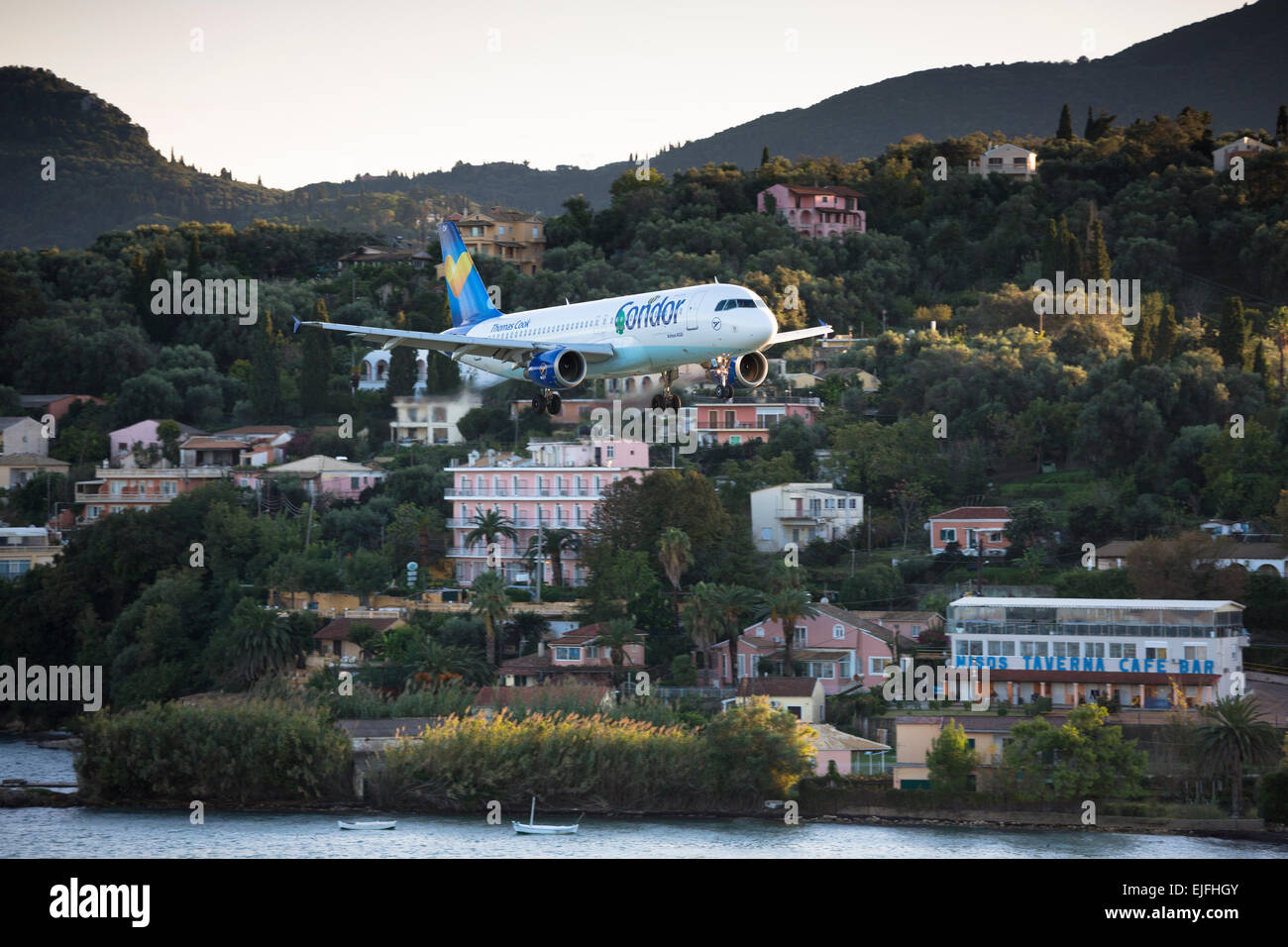 Thomas Cook Condor jet airplane tourist charter flight flying into Kerkyra, Corfu Town, ready for landing, Ionian Islands, Greec Stock Photo