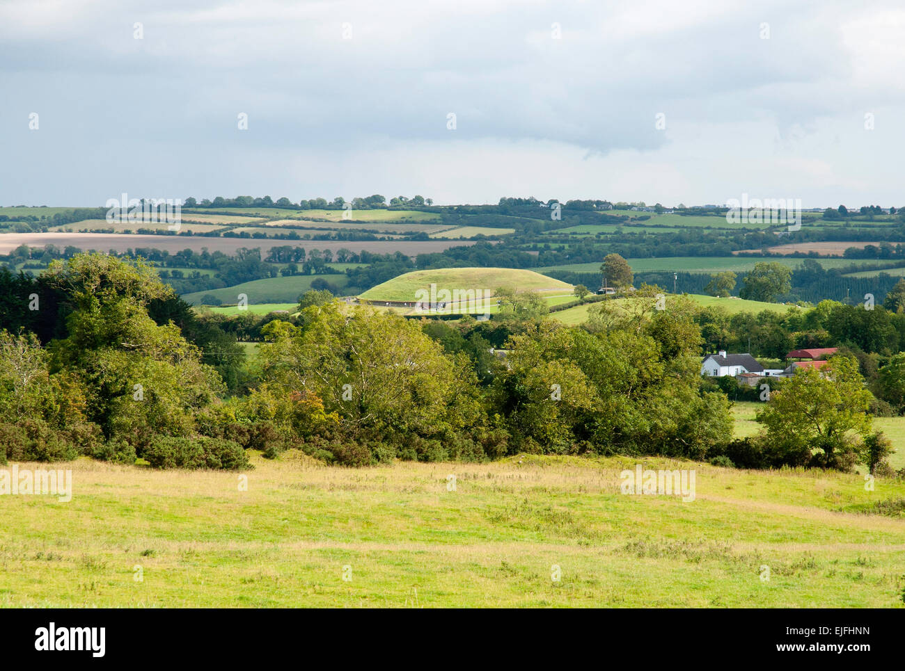 Newgrange as seen from the Knowth Site, County Meath, Ireland Stock