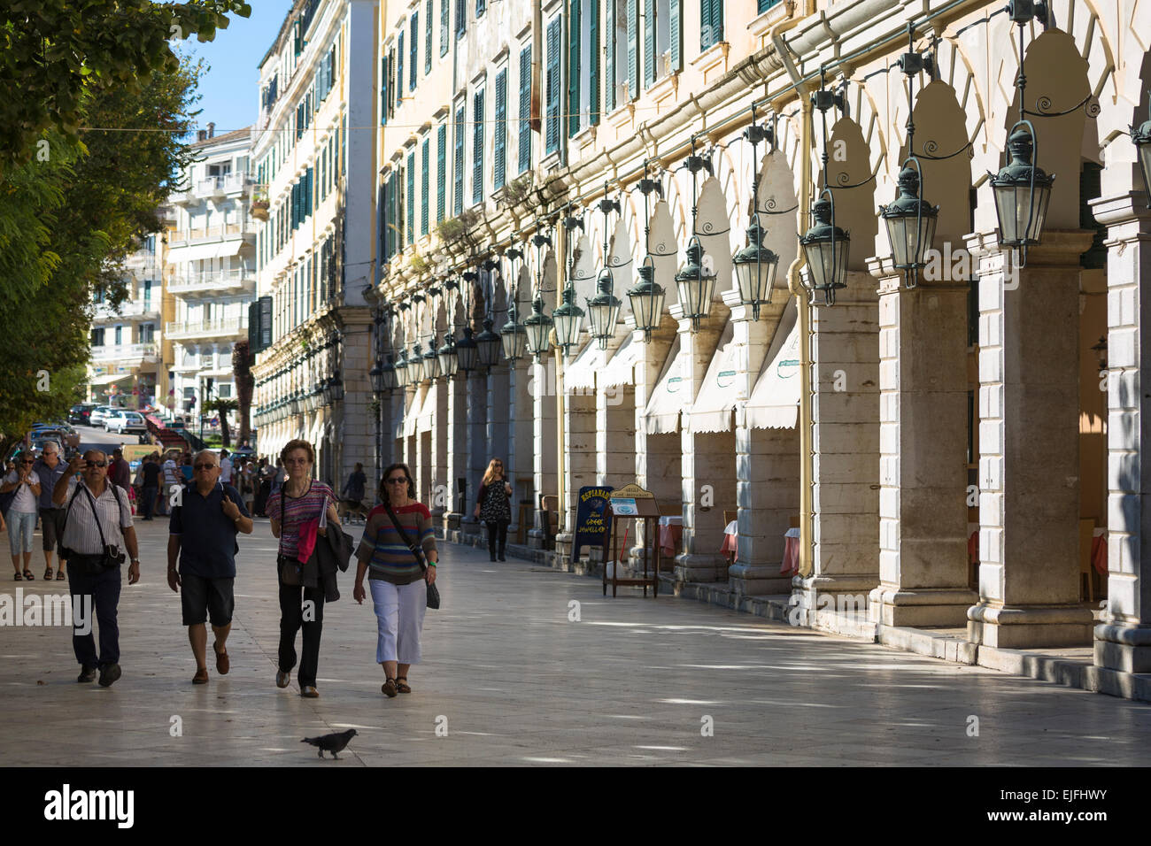 People strolling along the arcades of the Liston at the Spianada in Kerkyra, Corfu Town, Greece Stock Photo