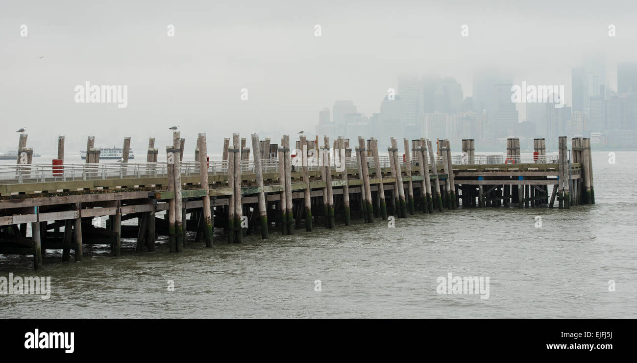 Pier at Upper New York Bay, Liberty Island, New York Harbor, Manhattan, New York City, New York State, USA Stock Photo