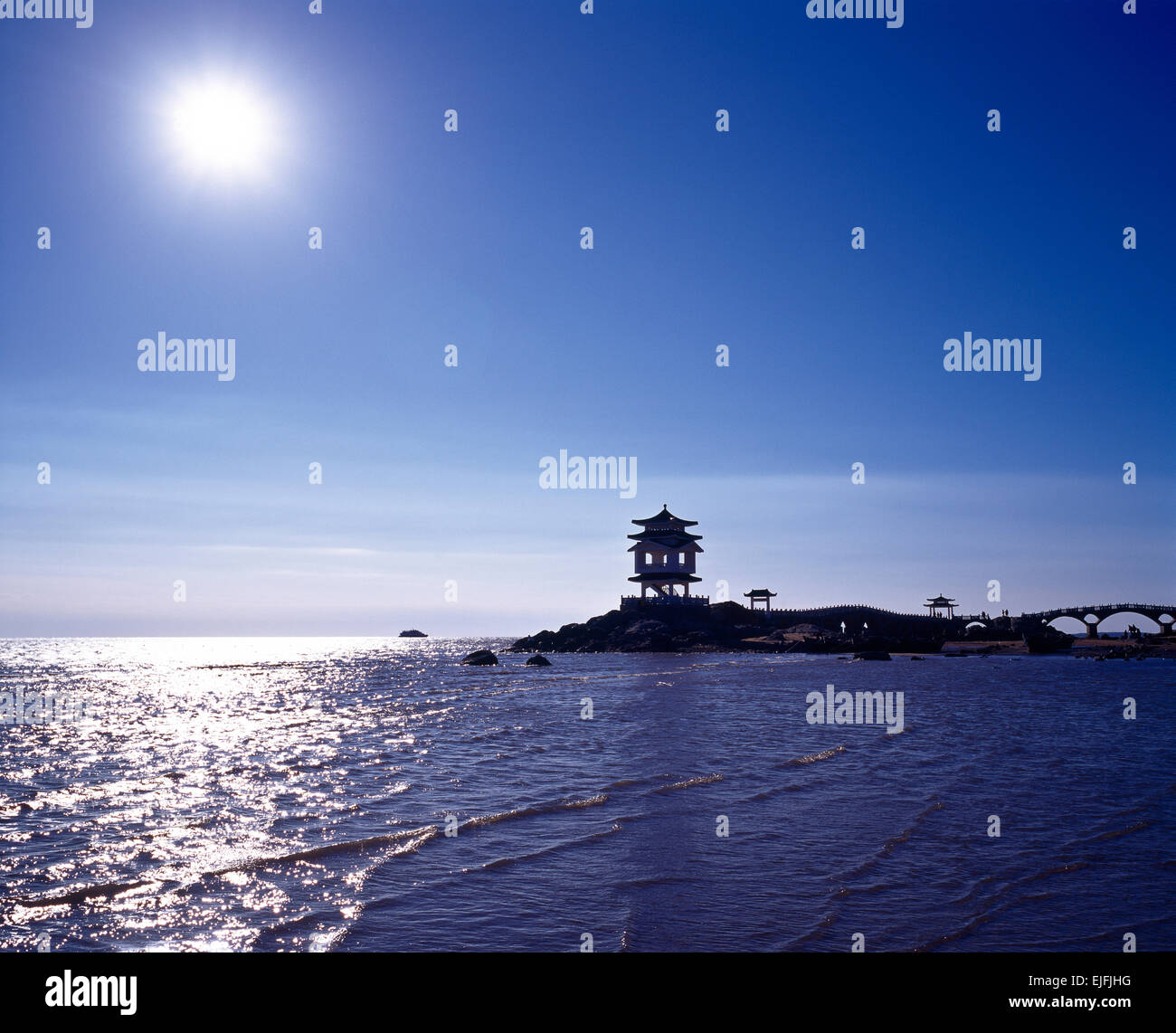 Summerhouse silhouette on sea liaoning china Stock Photo