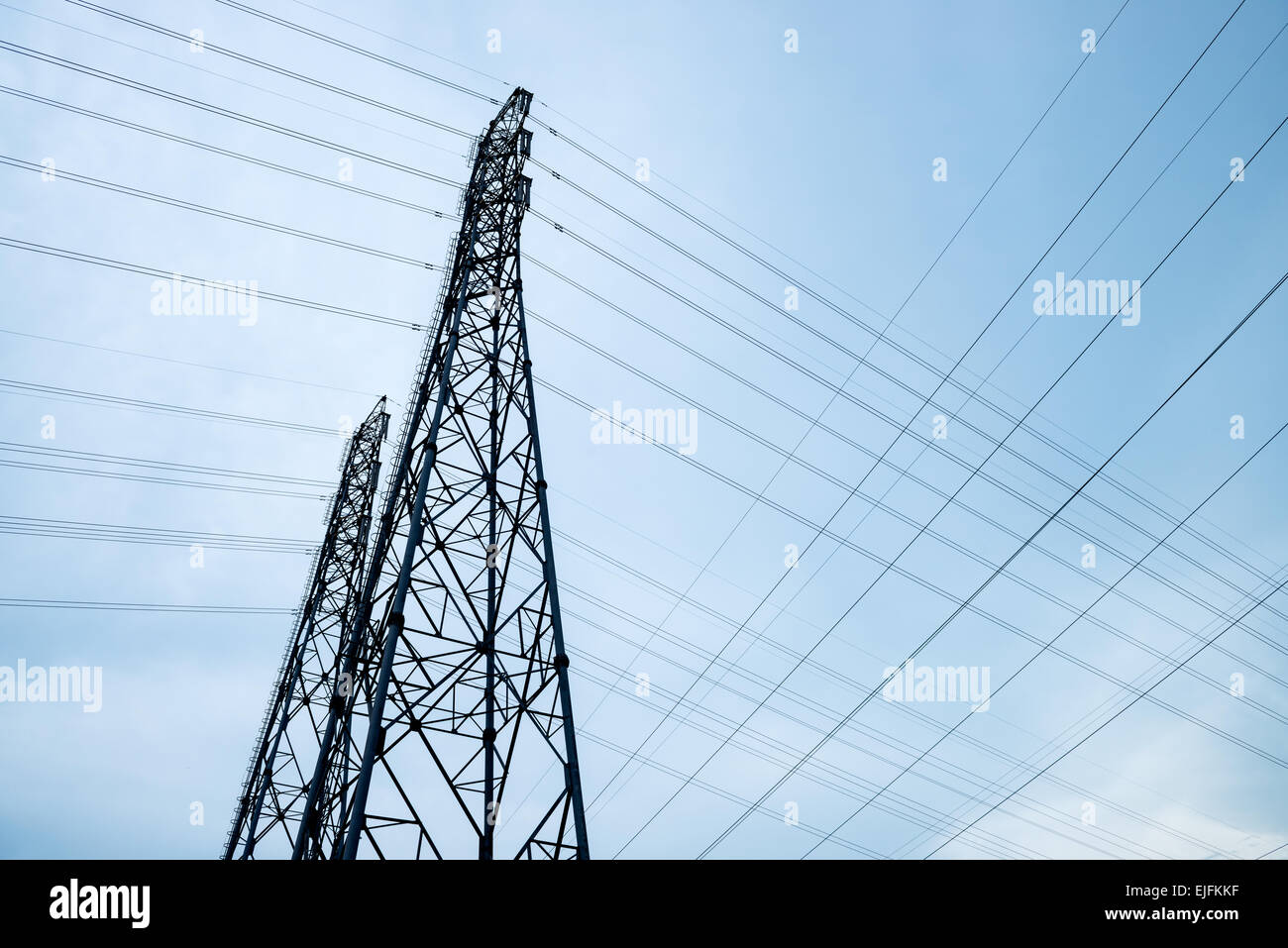 alternative architecture blue built cable cloudy current danger distribution electric electrical electricity energetic energy en Stock Photo