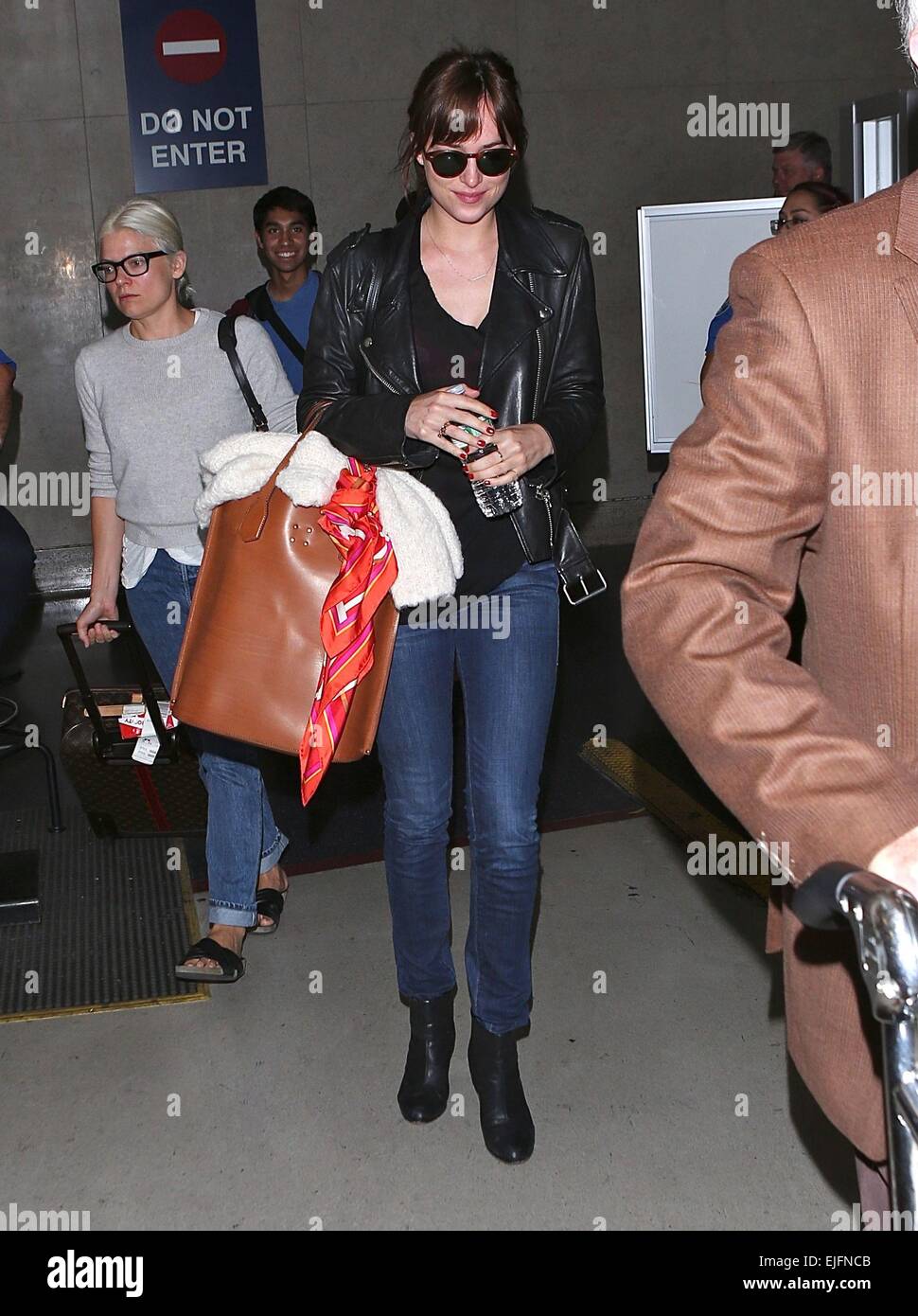 Dakota Johnson arrives at Los Angeles International (LAX) airport Featuring: Dakota Johnson Where: Los Angeles, California, United States When: 21 Sep 2014 Stock Photo