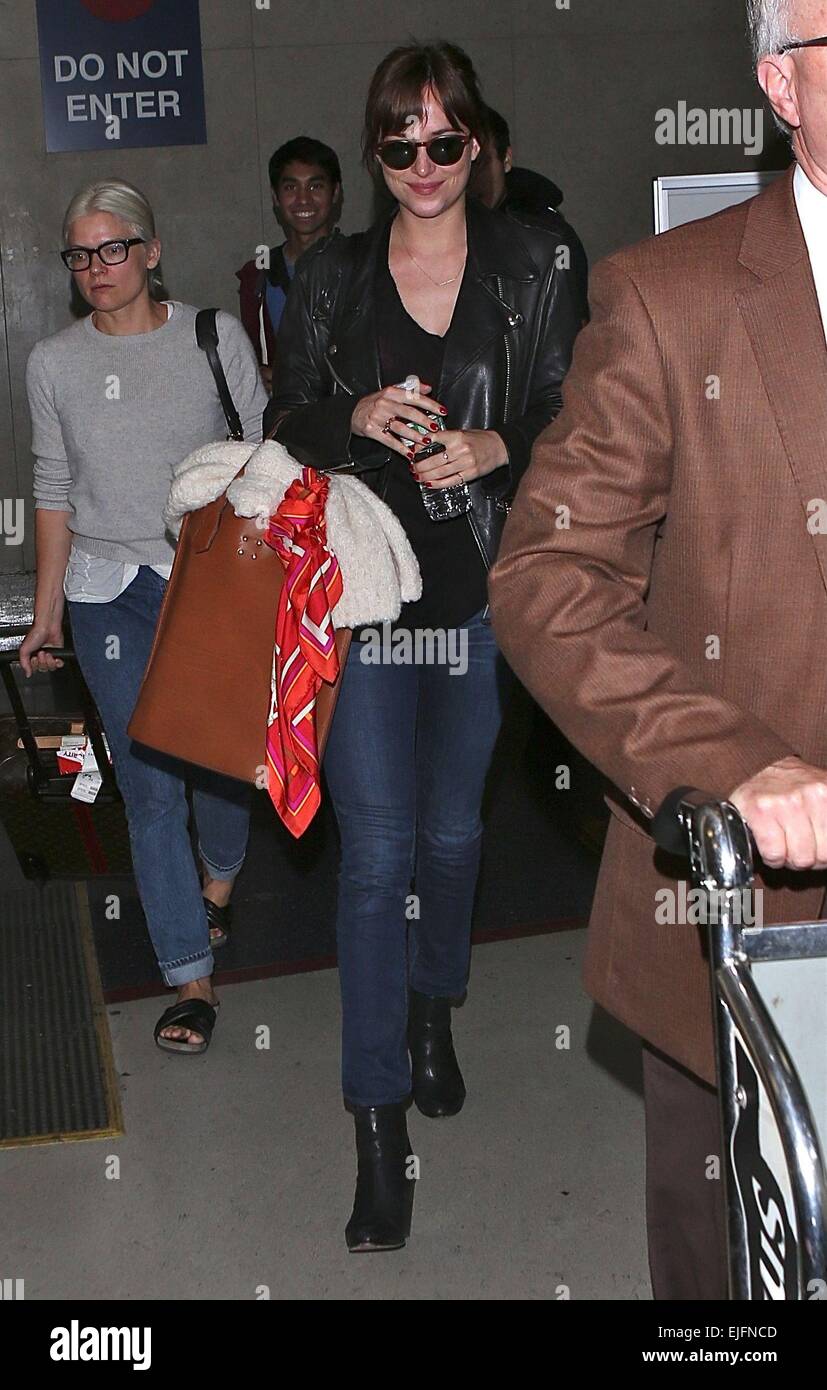 Dakota Johnson arrives at Los Angeles International (LAX) airport Featuring: Dakota Johnson Where: Los Angeles, California, United States When: 21 Sep 2014 Stock Photo