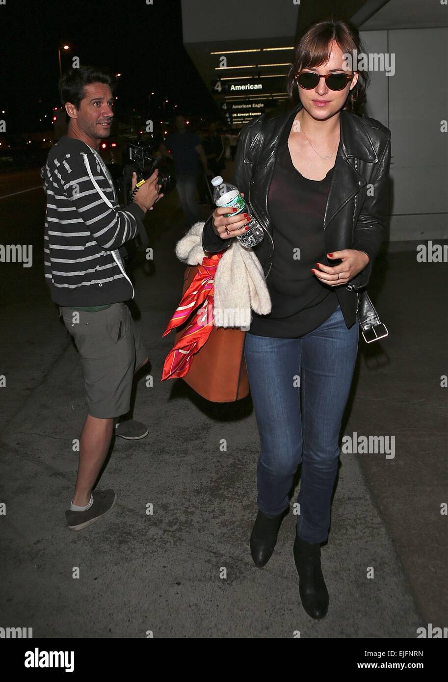 Dakota Johnson arrives at Los Angeles International (LAX) airport Featuring: Dakota Johnson Where: Los Angeles, California, United States When: 21 Sep 2014 Stock Photo