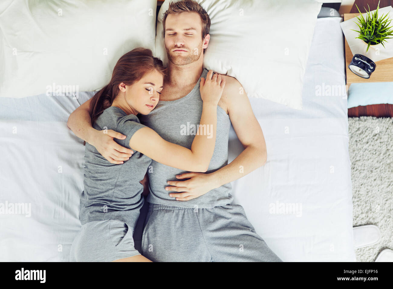 Young couple sleeping in embrace Stock Photo
