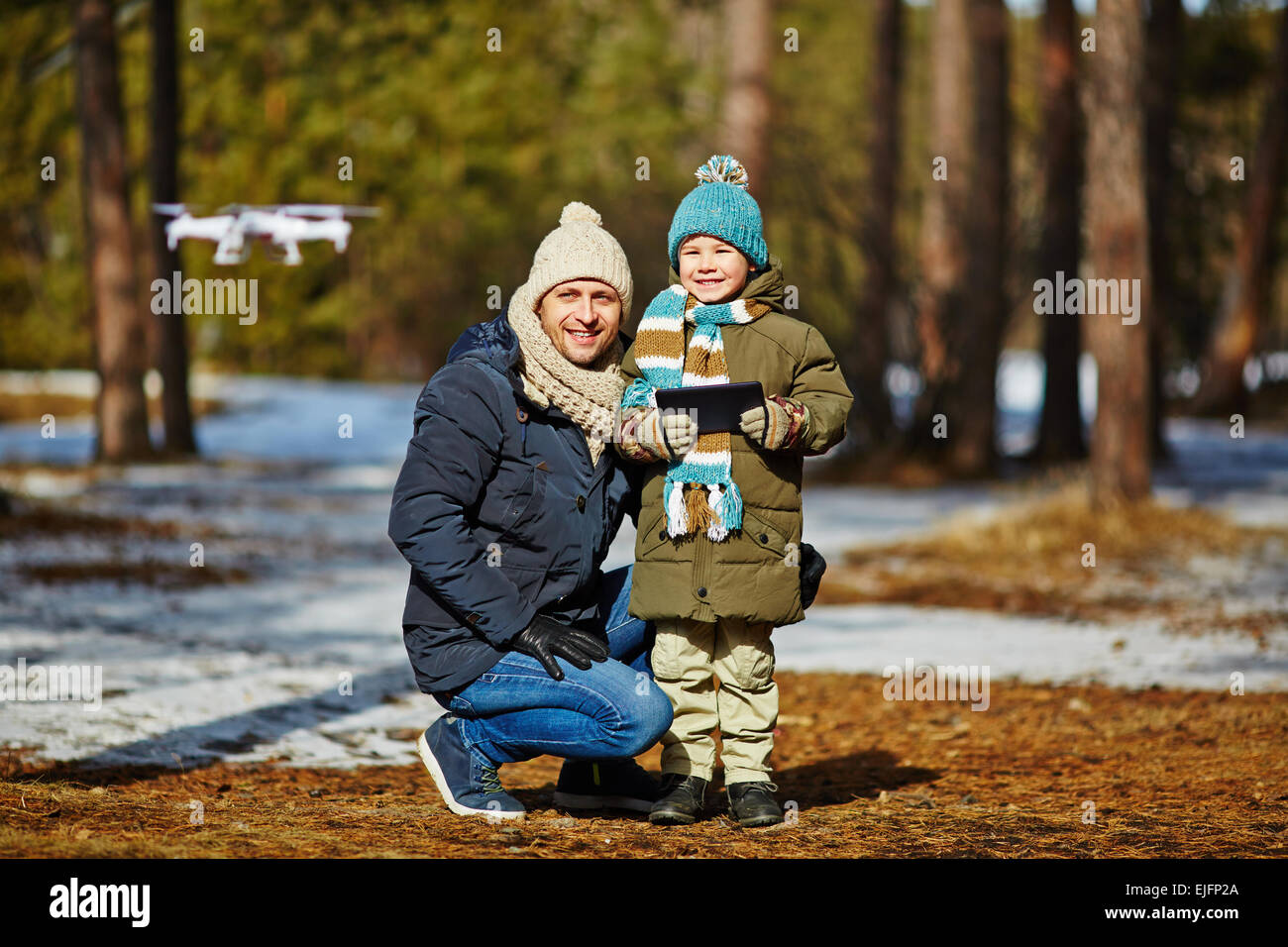 Father teaching son to play with RC toy Stock Photo