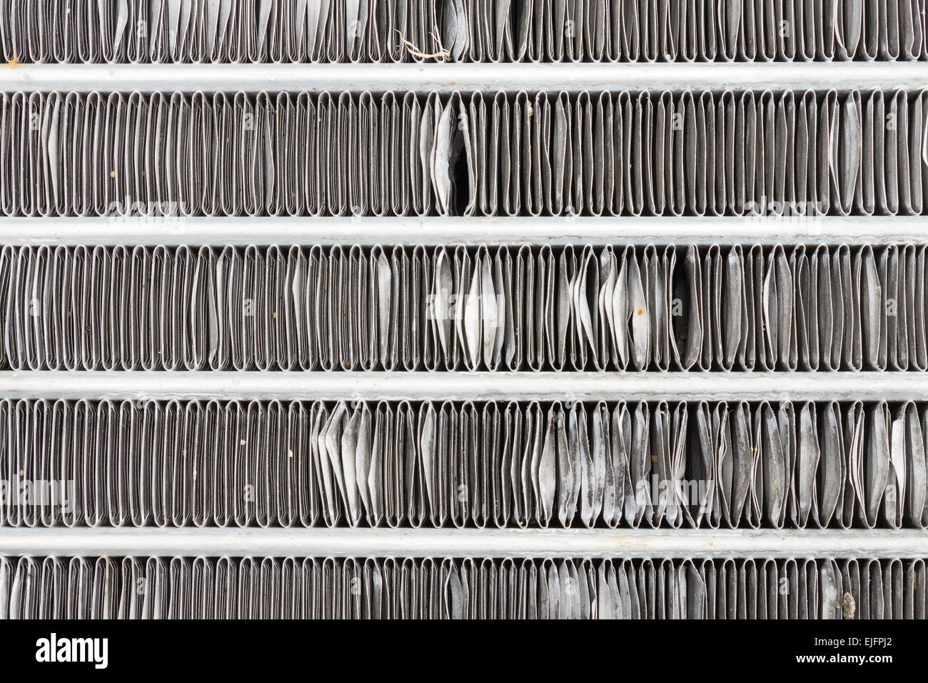 Air condenser of car or cooling coil in old style. Old aluminum fin