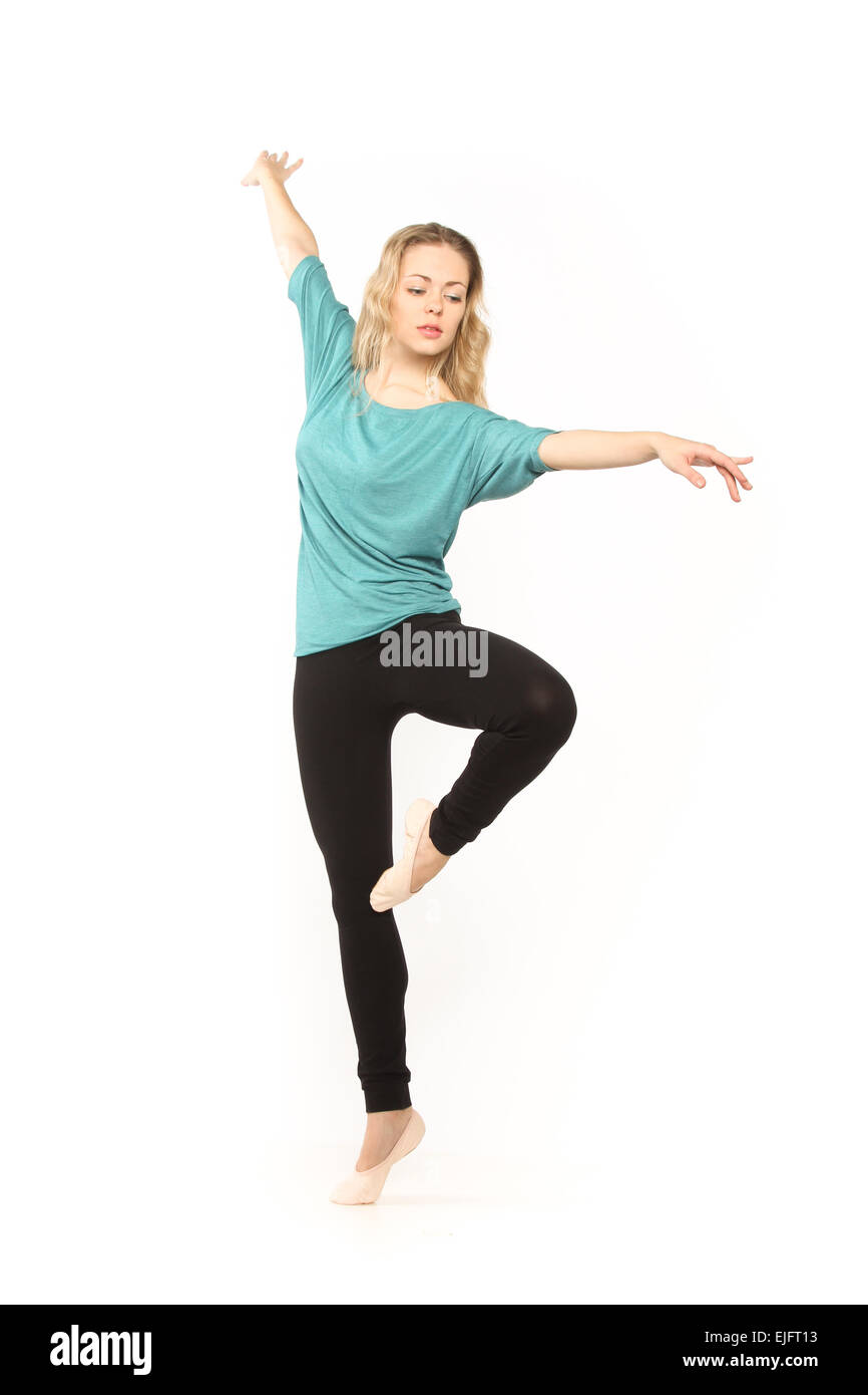 young beautiful dancer posing on a studio background Stock Photo