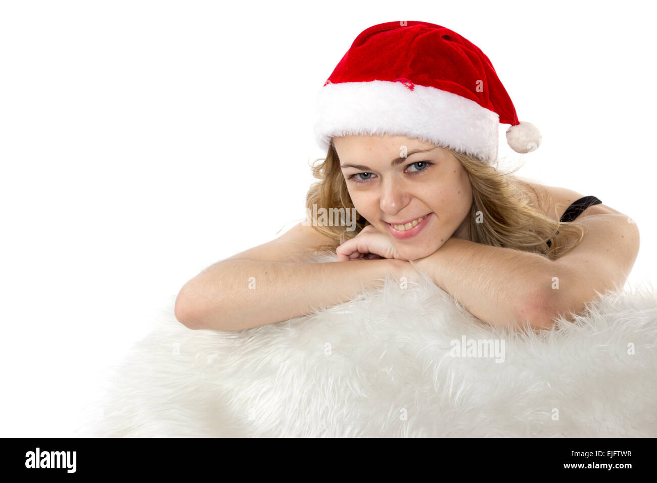 Portrait of joyful pretty woman in red santa claus hat isolated on ...